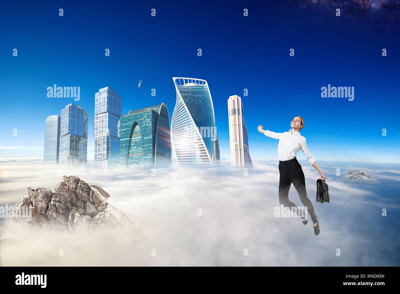 Businesswoman in formal wear flying in blue sky. Stock Photo