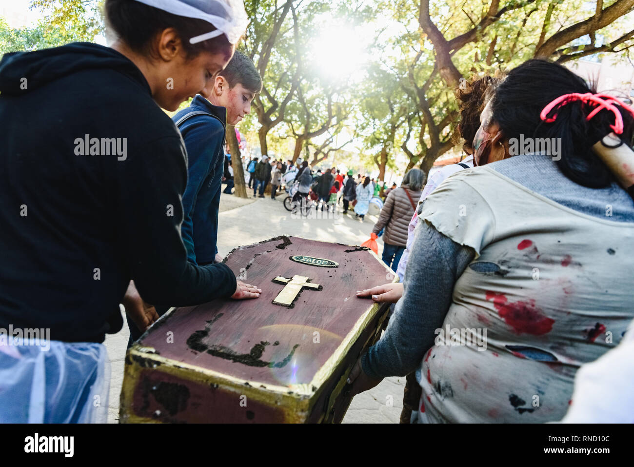 Valencia, Spain - February 16, 2019: False coffin transported by actors disguised in a street carnival. Stock Photo
