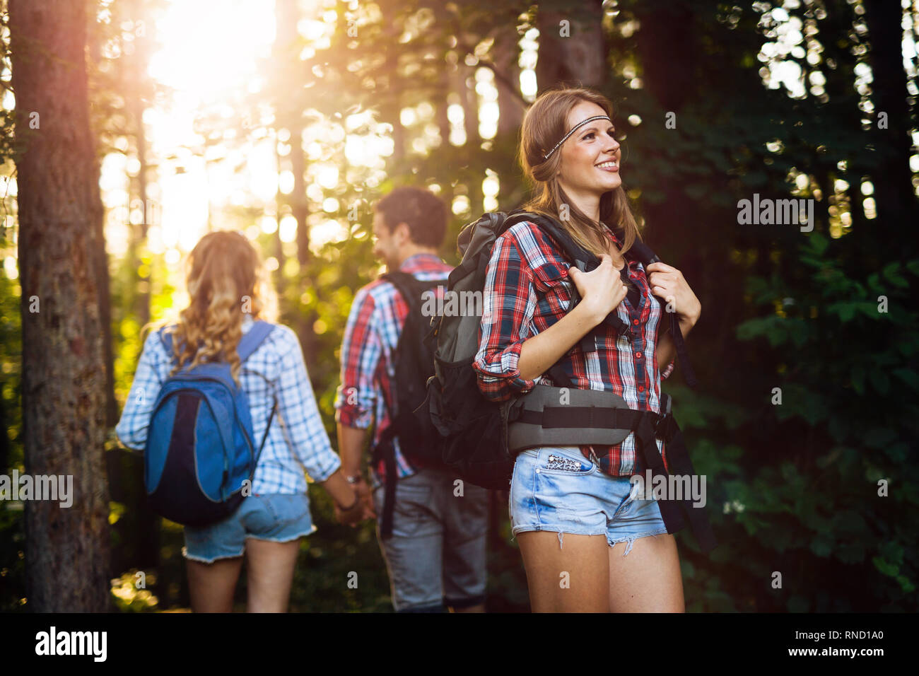Group of backpacking hikers going for forest trekking Stock Photo Alamy