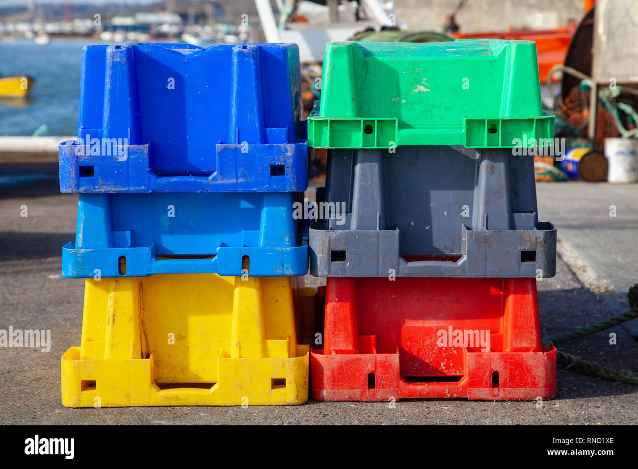 Coloured Plastic Crates on the Dockside Stock Photo