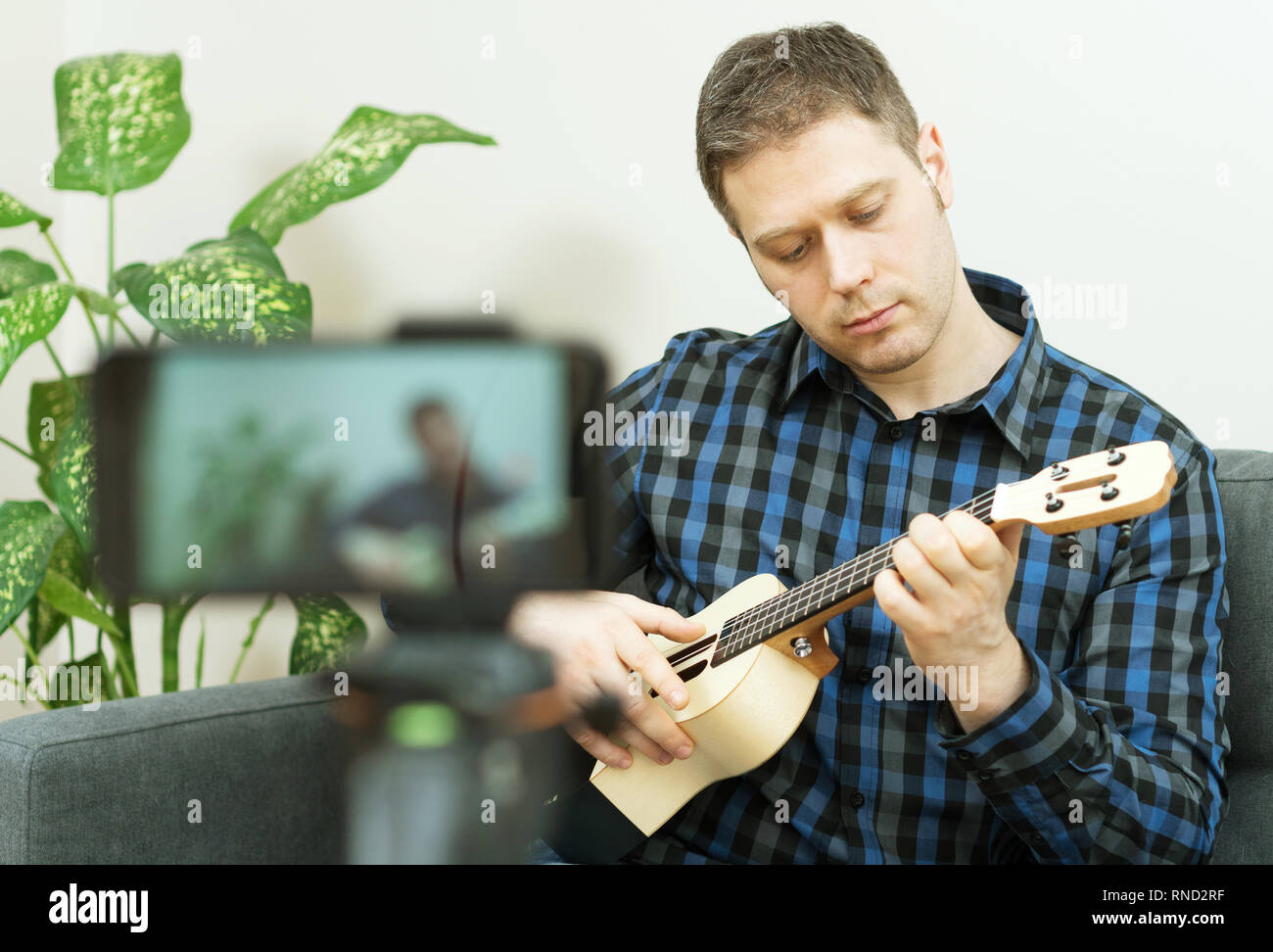 Handsome man recording song. Vlogging concept. Stock Photo