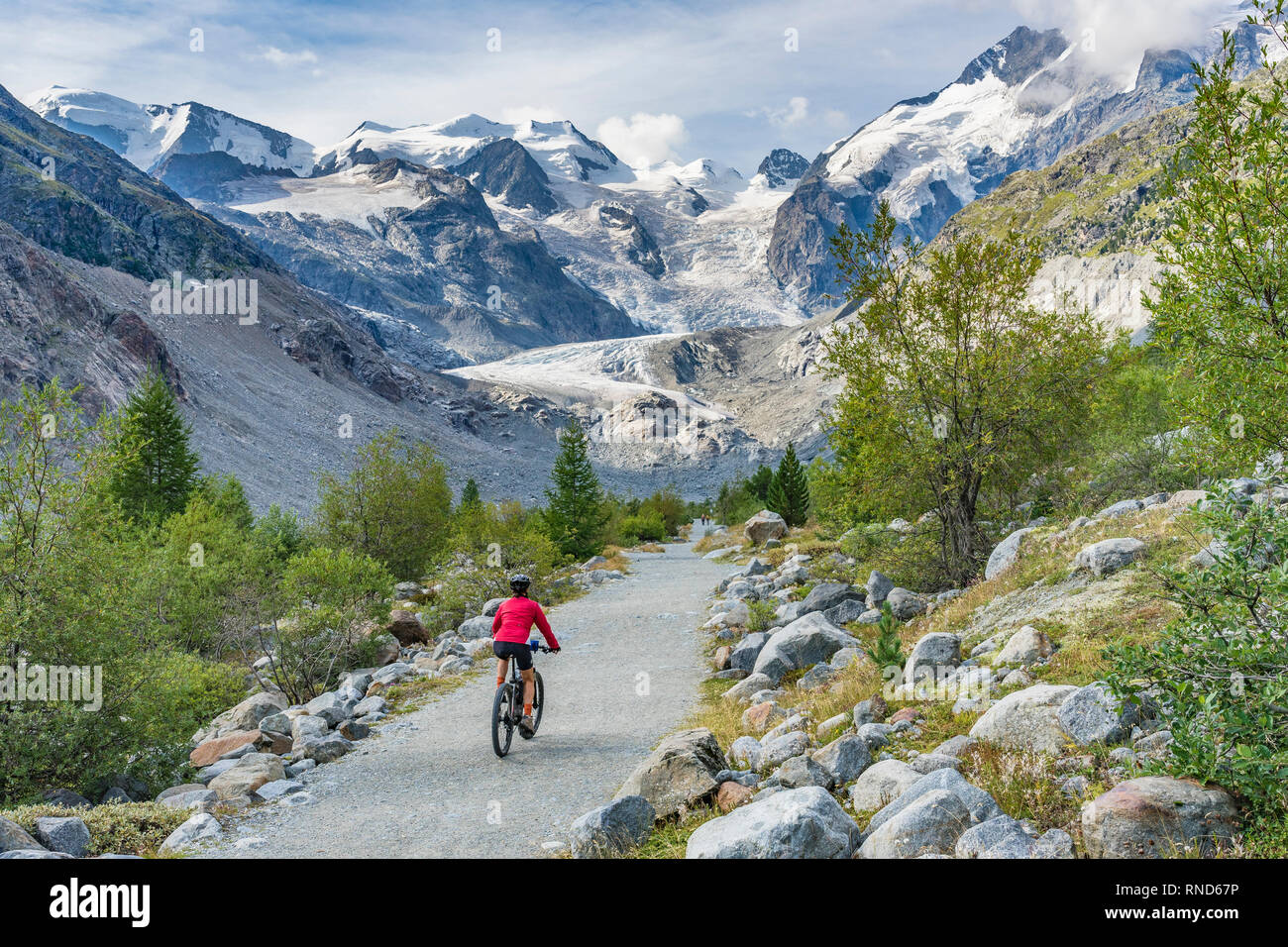 Senior woman, riding her e-mountain bike on the trail to the Morteratsch  glacier near Pontresina , Engadin, Switzerland,Alps Stock Photo - Alamy
