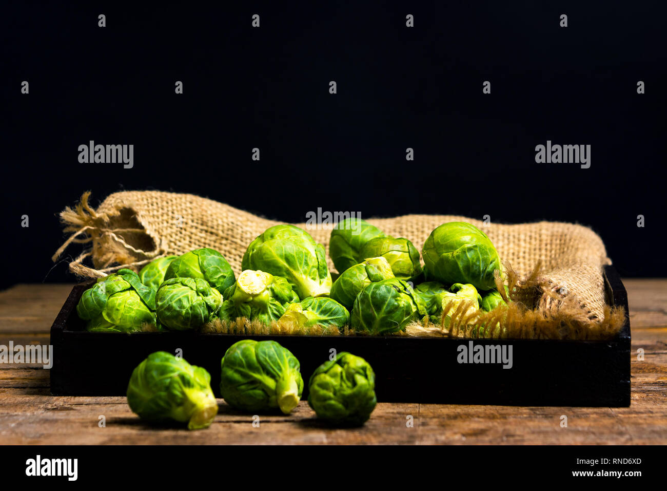 Brussels sprout vegetables in a bowl on a table Stock Photo
