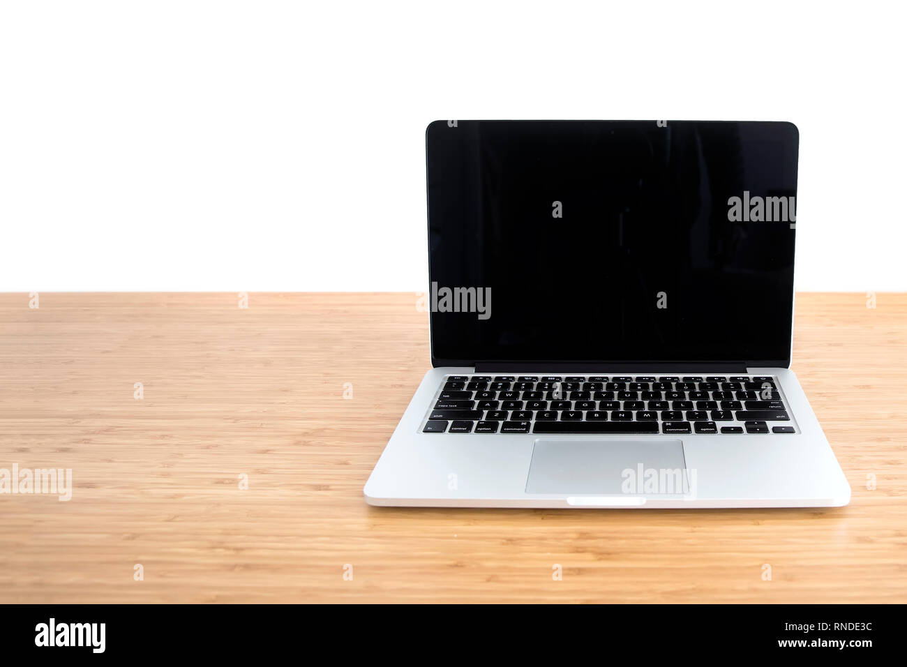 Laptop blank screen on wooden table isolated on white background Stock ...