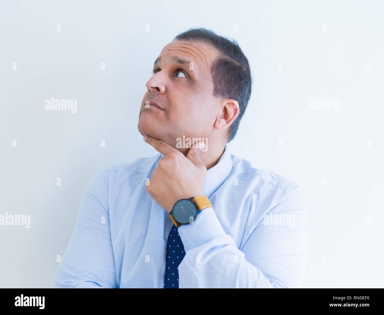 Middle age man thinking clueless about a question Stock Photo