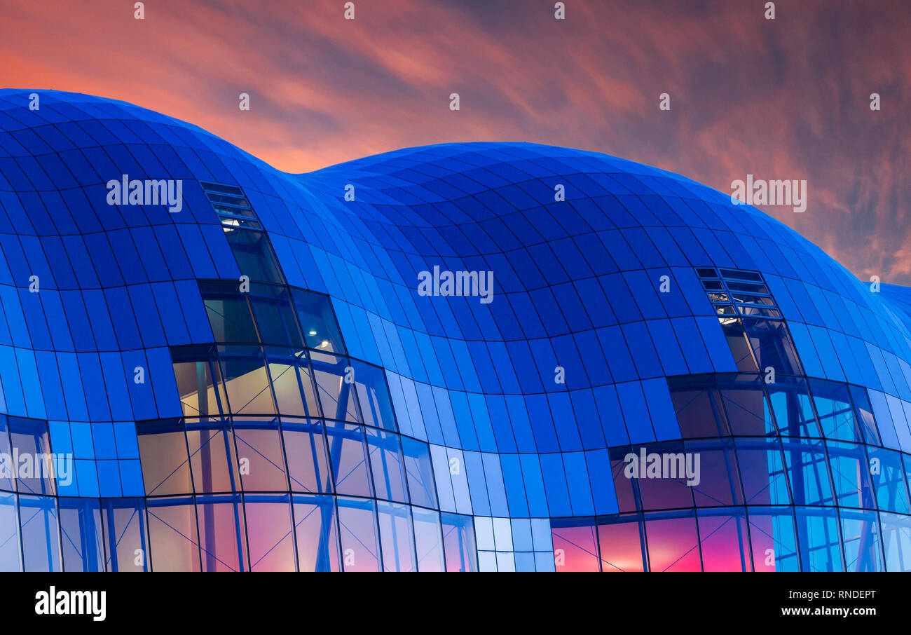 The Sage Gateshead illuminated against a colourful sky at dusk. Gateshead. England. UK Stock Photo