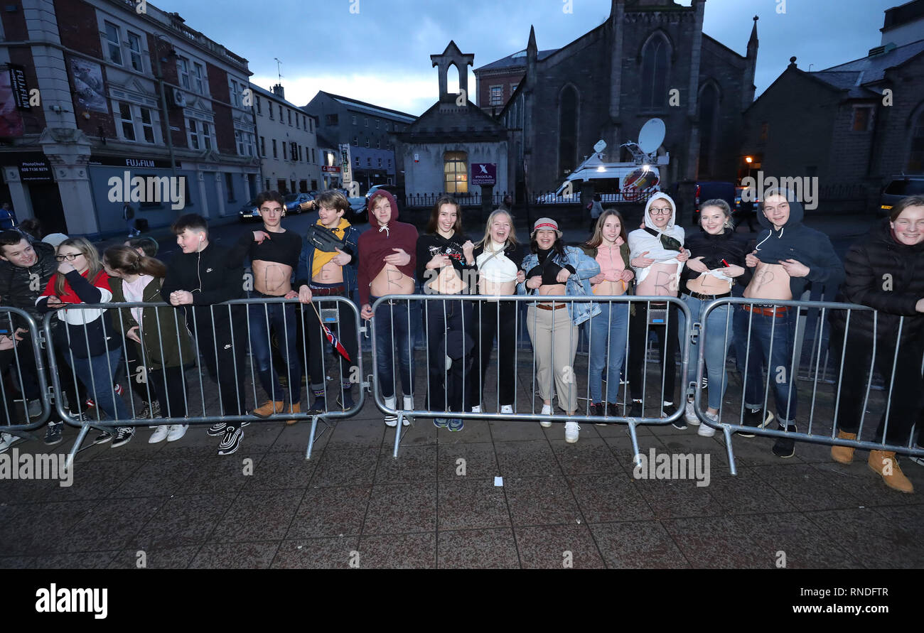 Fans from Norway pose with Derry Girls written on ther stomachs at the Omniplex Cinema in Londonderry for the Derry Girls premiere ahead of the broadcast of the second series on Channel 4. Stock Photo