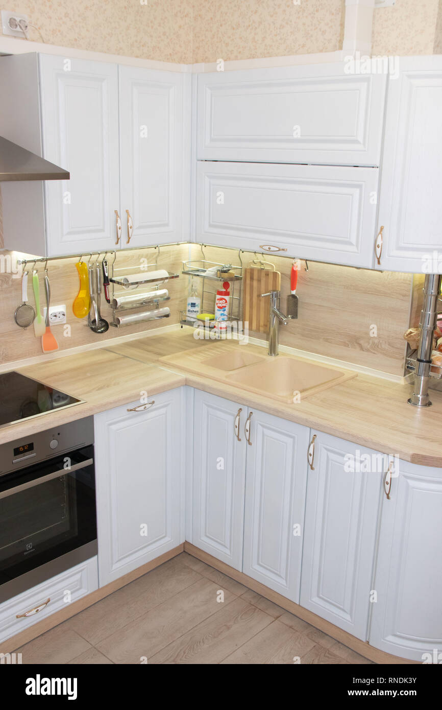 White modern kitchen from solid oak. Modern kitchen. White kitchen. Russia,  St. Petersburg, Murino February 10 2019 Stock Photo - Alamy, image size:866x1390