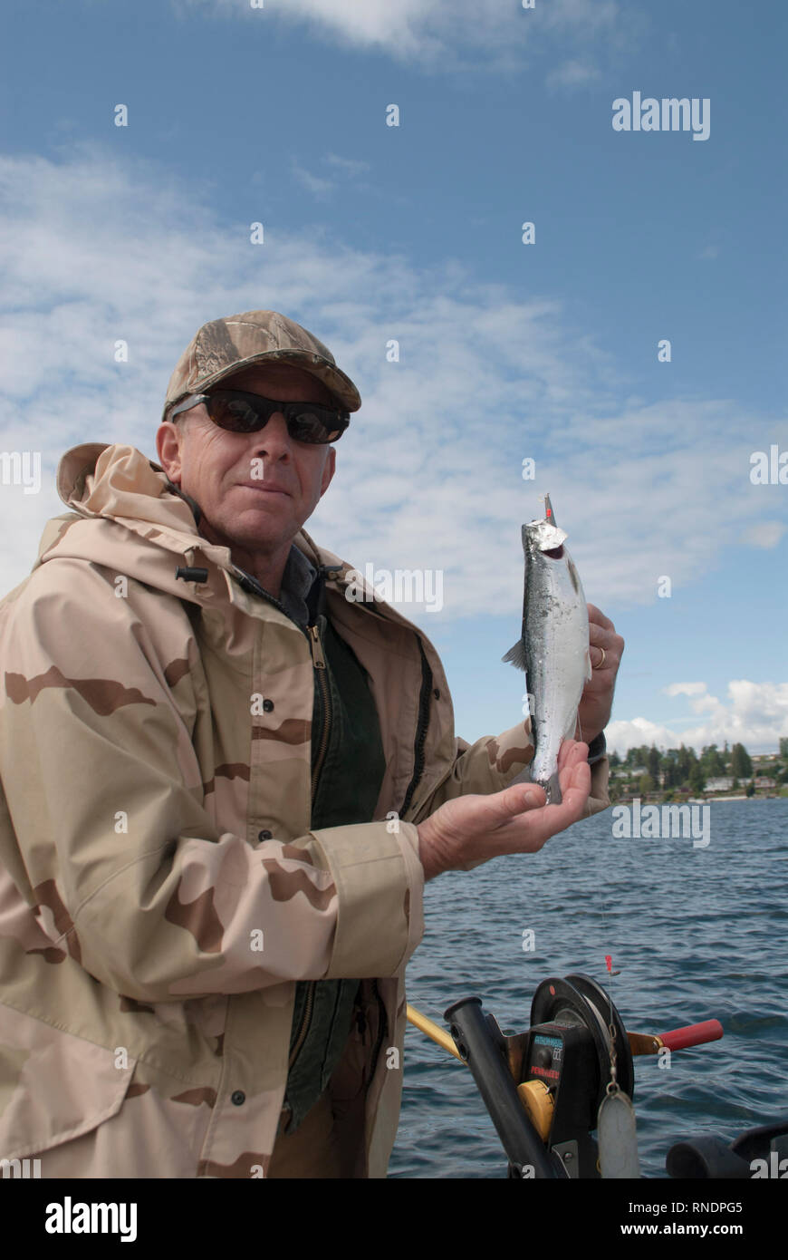 Doug Smith holds Kokanee caught in the Lake Stevens Kokanee Derby at Lake Stvfens,Washington. Stock Photo