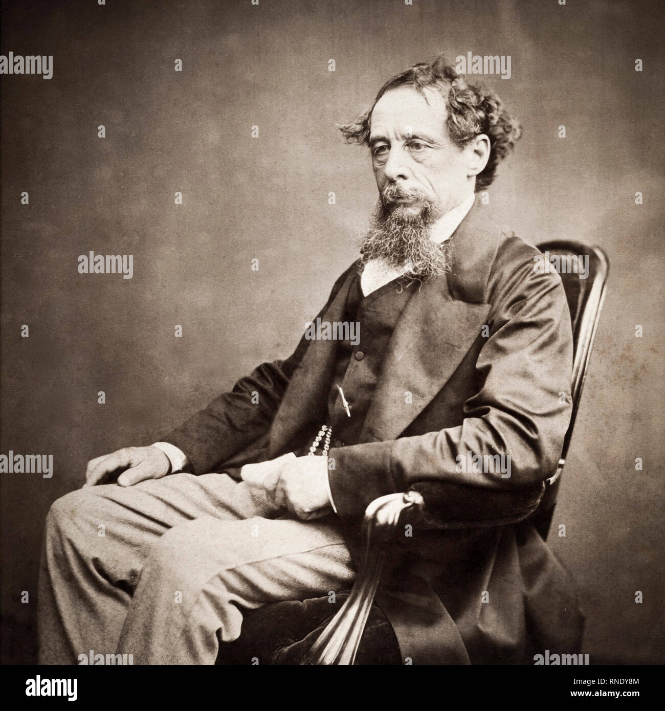 Charles Dickens, portrait, seated, photograph, c. 1860s Stock Photo