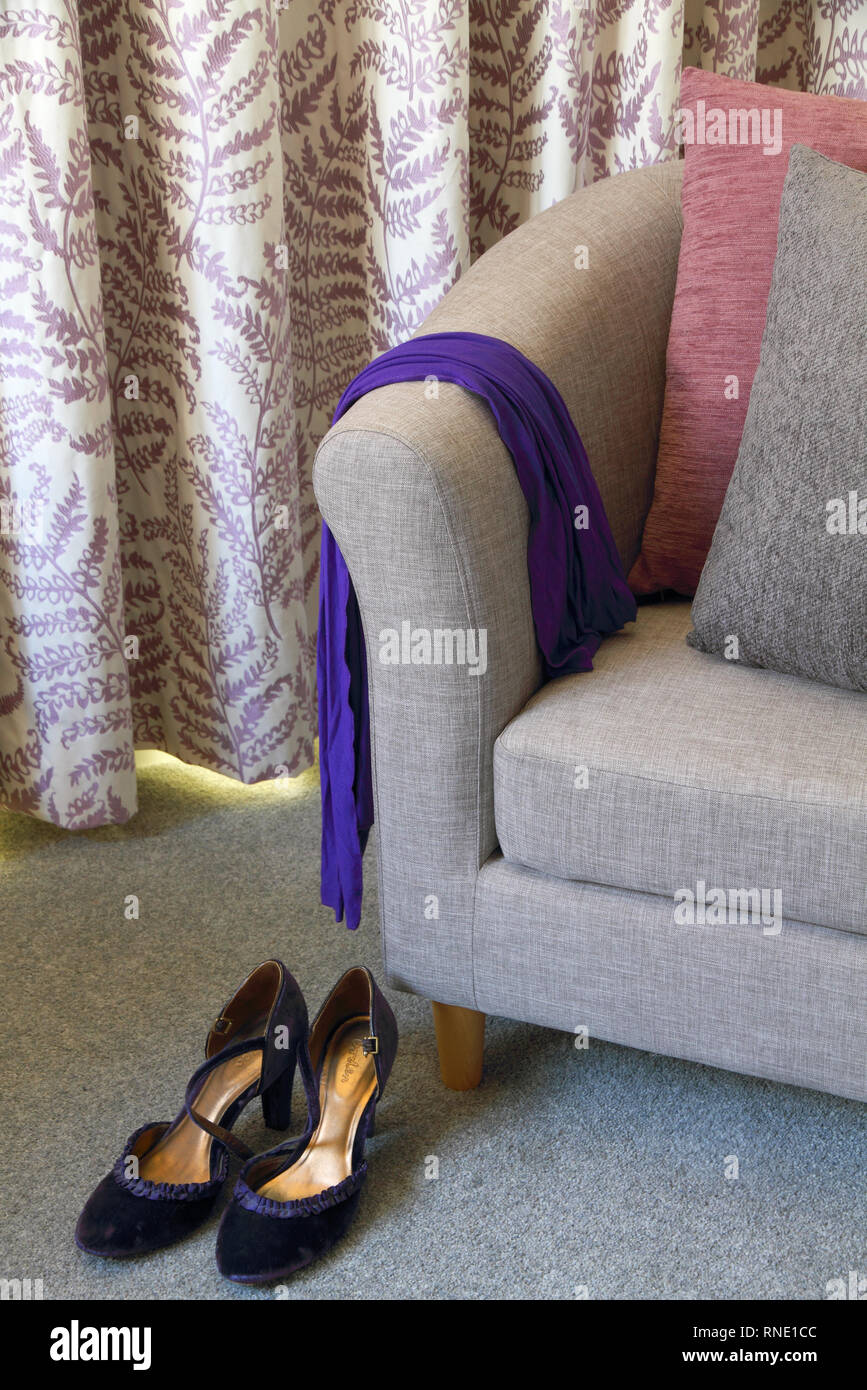 Easy chair with grey and raspberry cushions Stock Photo