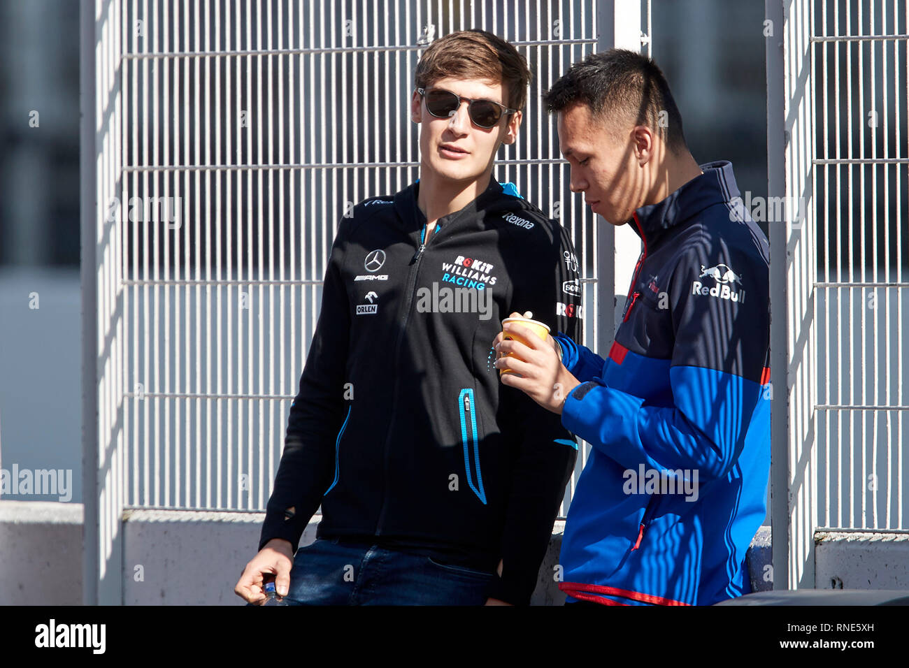 Barcelona, Spain. 18th Feb, 2019. George Russel (Williams Racing) and Alexander Albon (Red Bull Toro Rosso Honda) are seen during the winter test days at the Circuit de Catalunya in Montmelo (Catalonia). Credit: SOPA Images Limited/Alamy Live News Stock Photo
