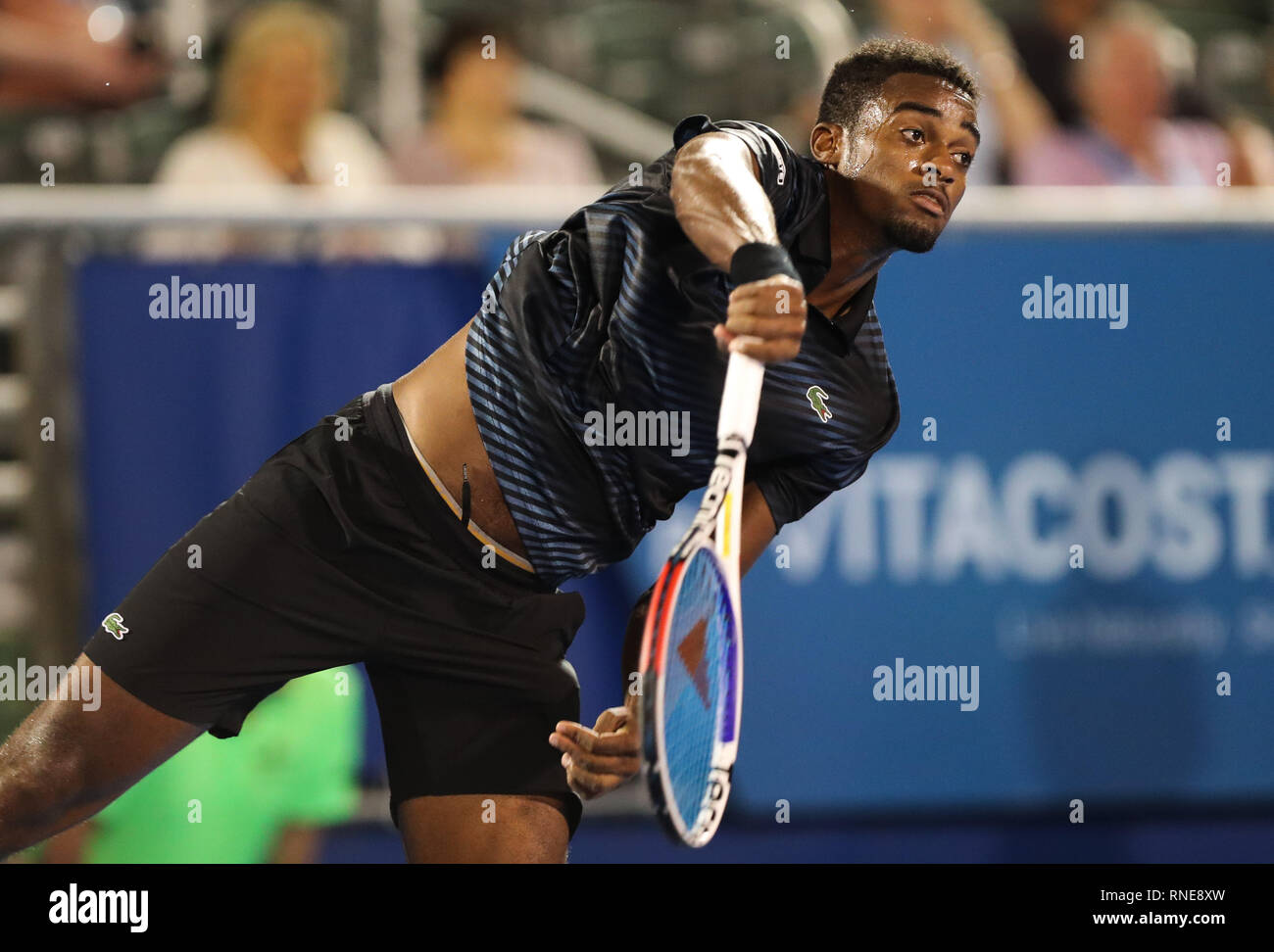 Delray Beach, Florida, USA. 18th Feb, 2019. Darian King, of Barbados,  serves against Lloyd Harris, of South Africa, during the first round at the  2019 Delray Beach Open ATP professional tennis tournament,