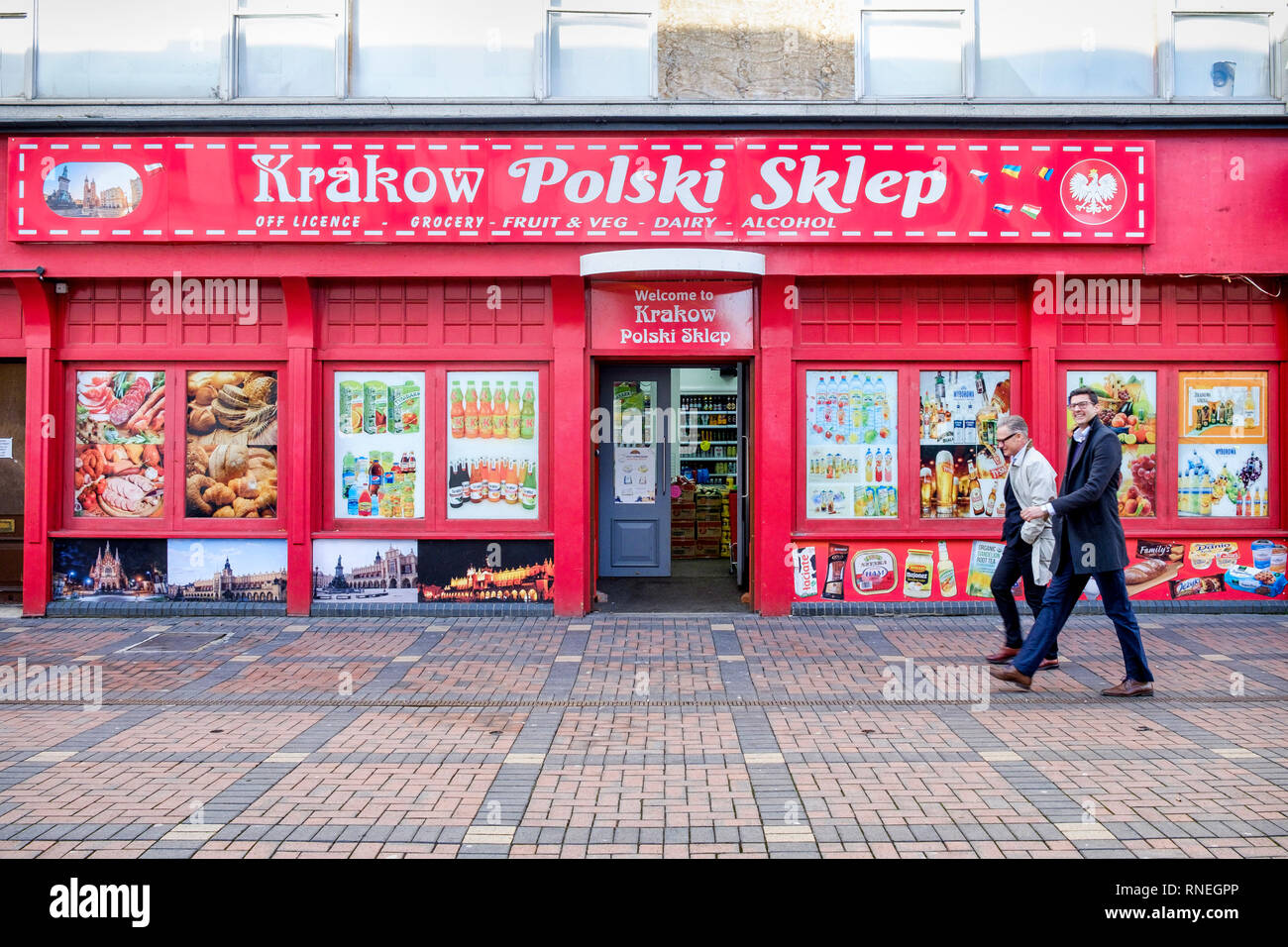 Swindon, Wiltshire, UK. 19th February, 2019. On the day that Honda has confirmed that they will be closing their car factory in the town two men are pictured walking past a Polish grocery shop in the town centre. Swindon was one of the first areas to declare a Leave result in the 2016 EU referendum. Many in the local community are worried that the job losses at Honda will have a catastrophic impact on the town. Credit: Lynchpics/Alamy Live News Stock Photo