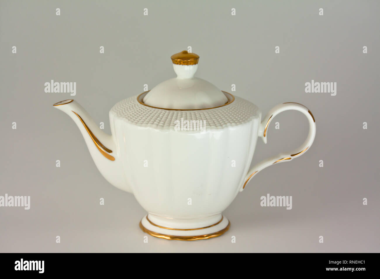 Beautiful white porcelain teapot on white background Stock Photo Alamy