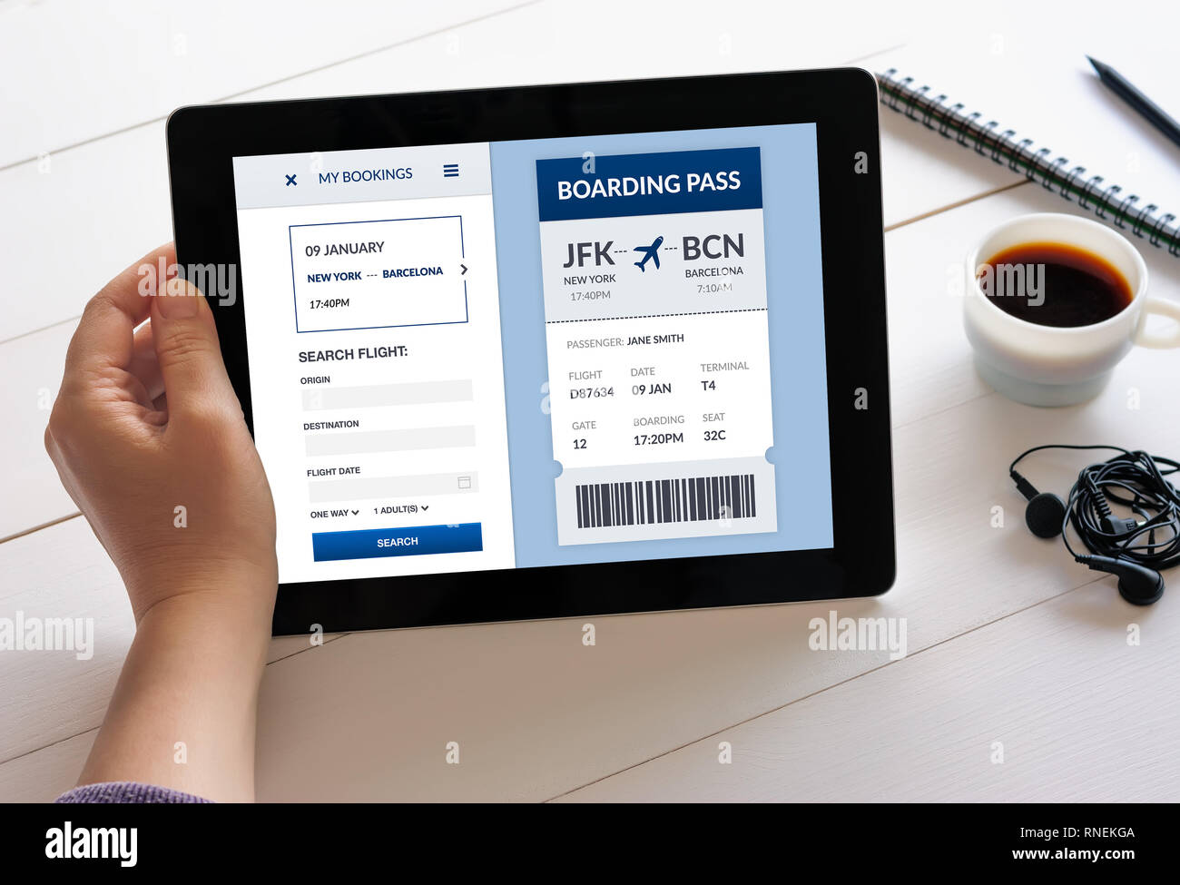 Hand holding digital tablet computer with boarding pass concept on screen. All screen content is designed by me Stock Photo
