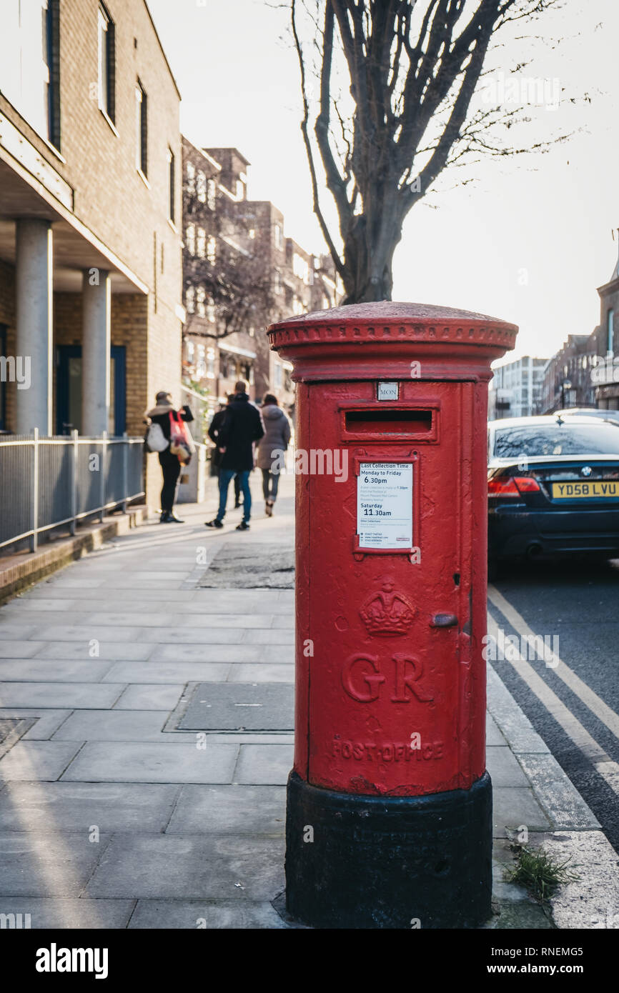 London, UK - February 3, 2019: Red postbox belonging to Royal Mail on a  street in London. Royal Mail is a postal service and courier company in the  Un Stock Photo - Alamy