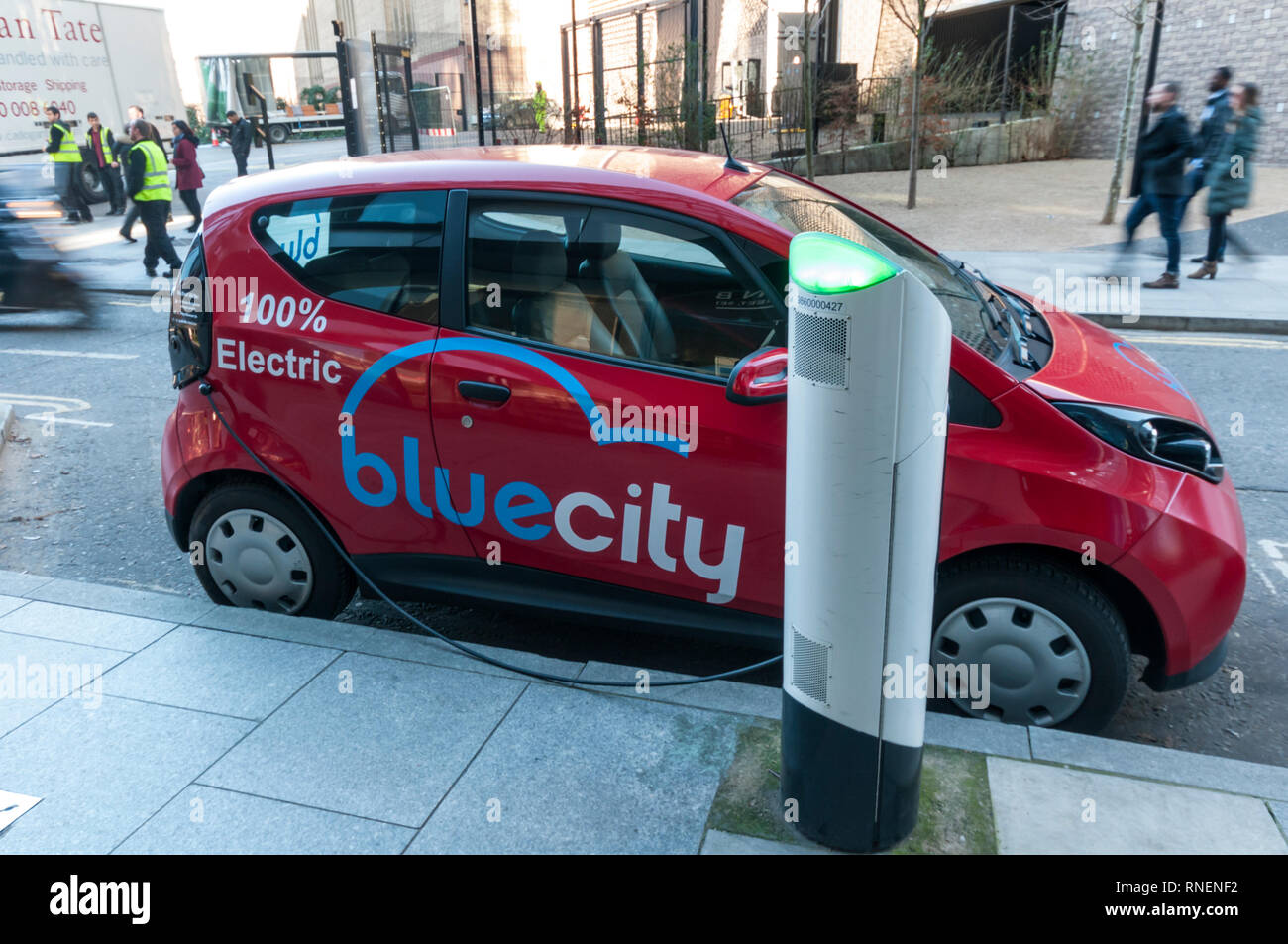 An electric Bolloré Bluecar of the  BlueCity Car Sharing scheme being charged at a charging point in central London. Stock Photo