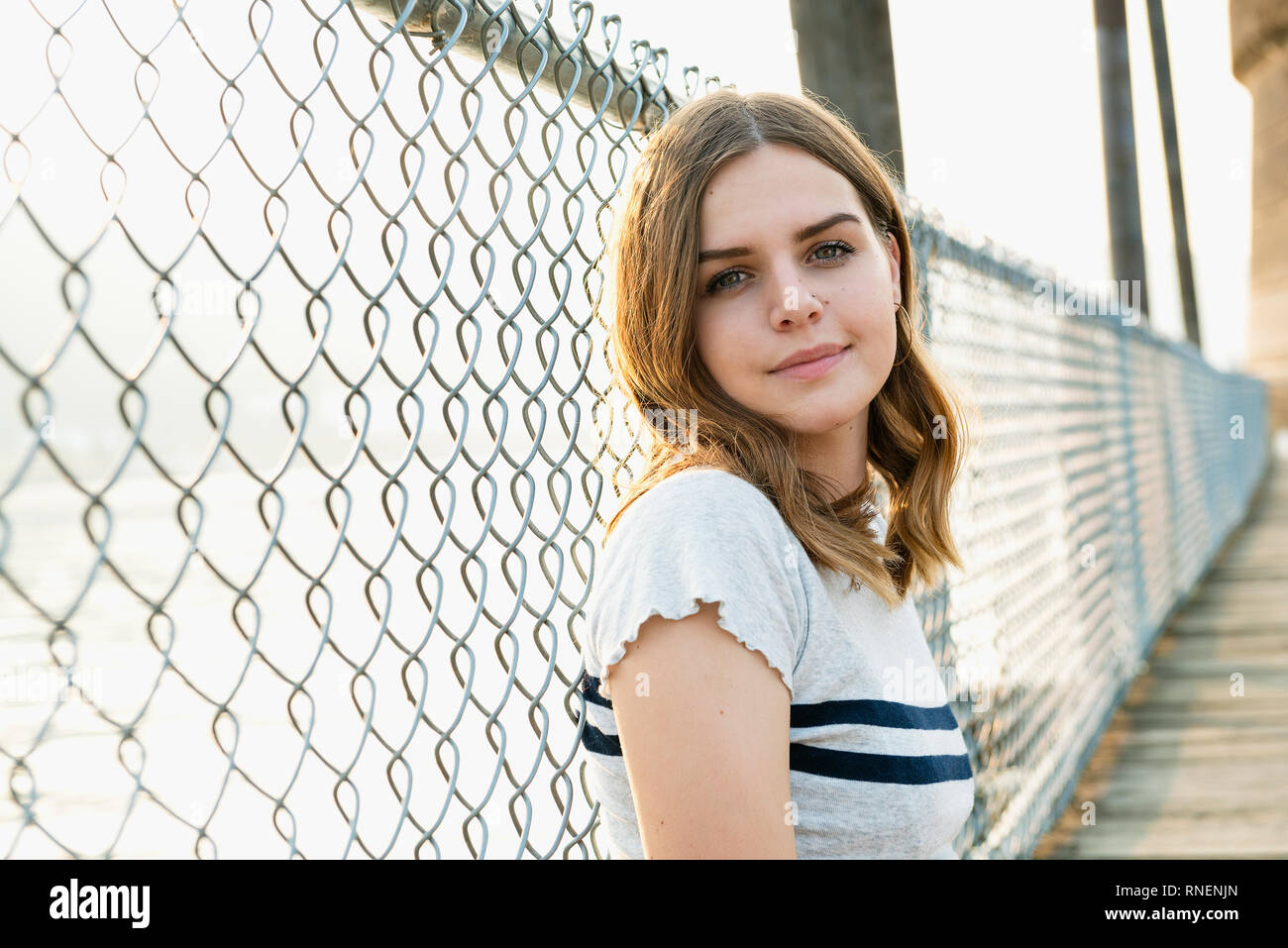 A young woman looking at the camera. Stock Photo