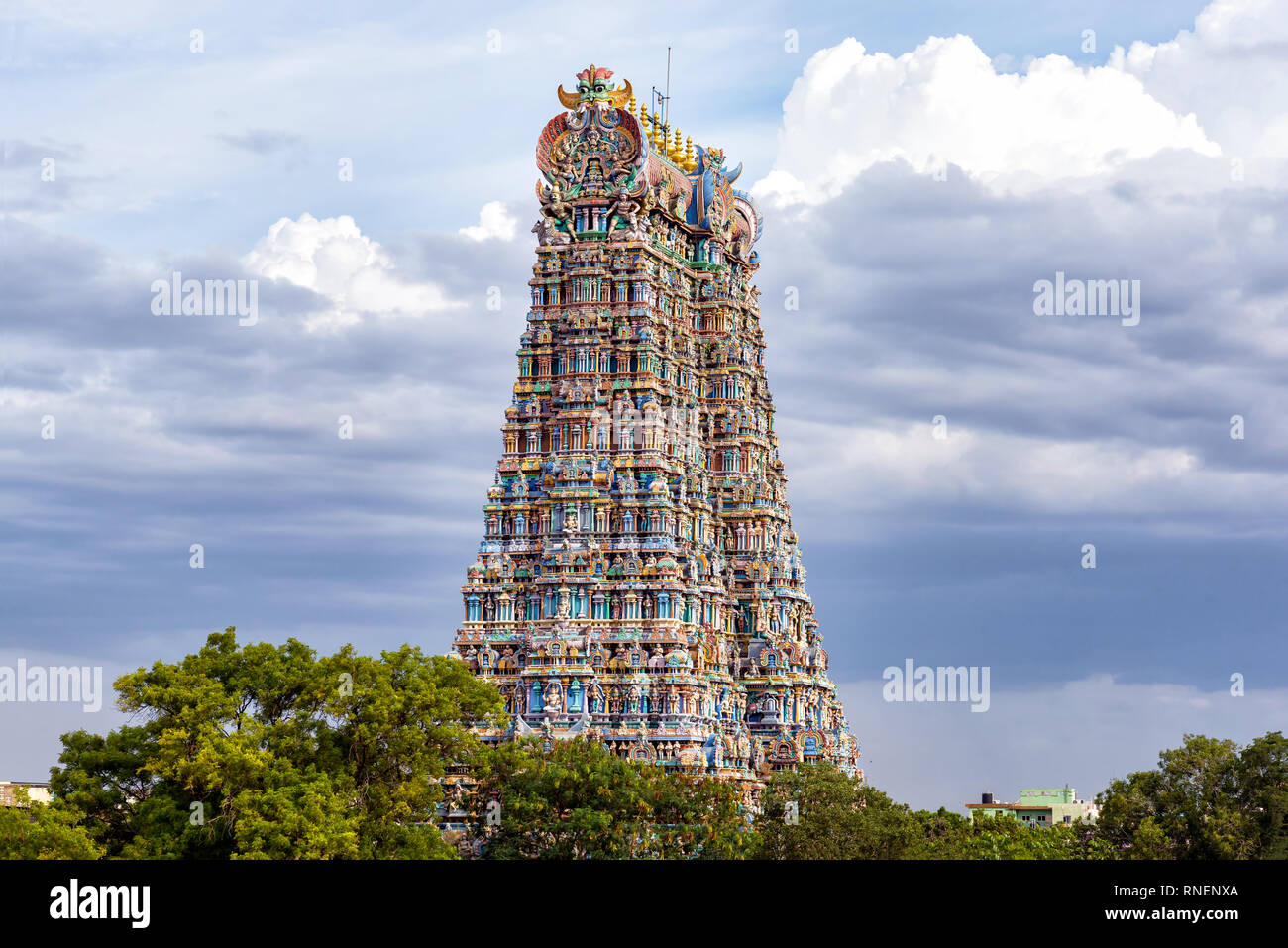 The north gopuram of the Meenakshi temple in Madurai, India. A Gopuram is a monumental gatehouse tower at the entrance of a Hindu temple. Stock Photo