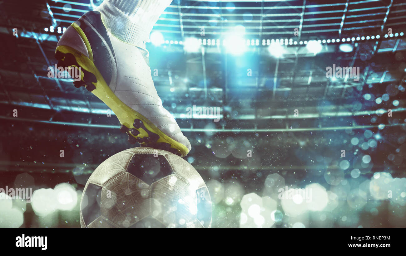 Close up of a soccer striker ready to kicks the ball at the stadium Stock Photo