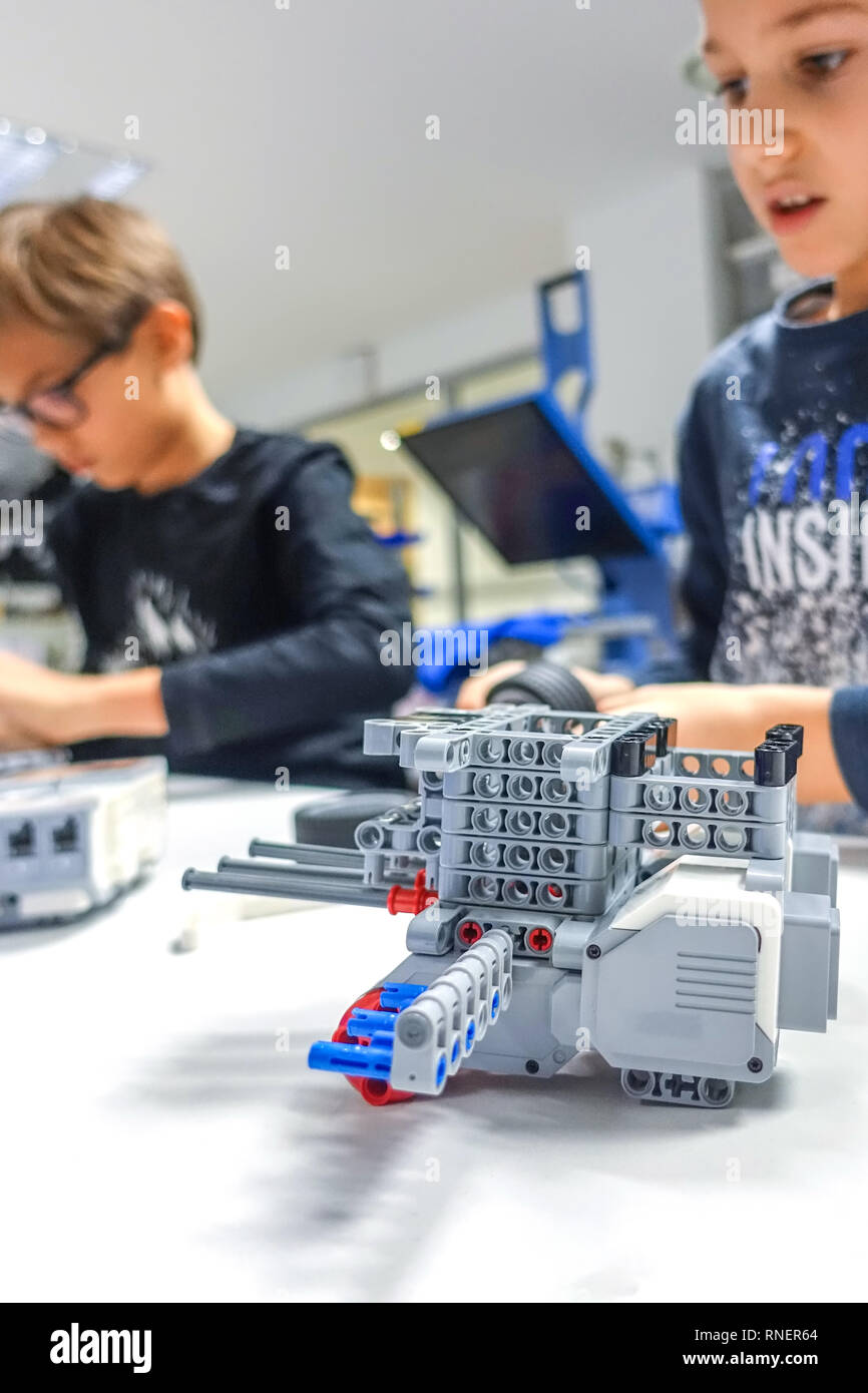 Kids making Lego robot mindstorms. Robotic learning technology