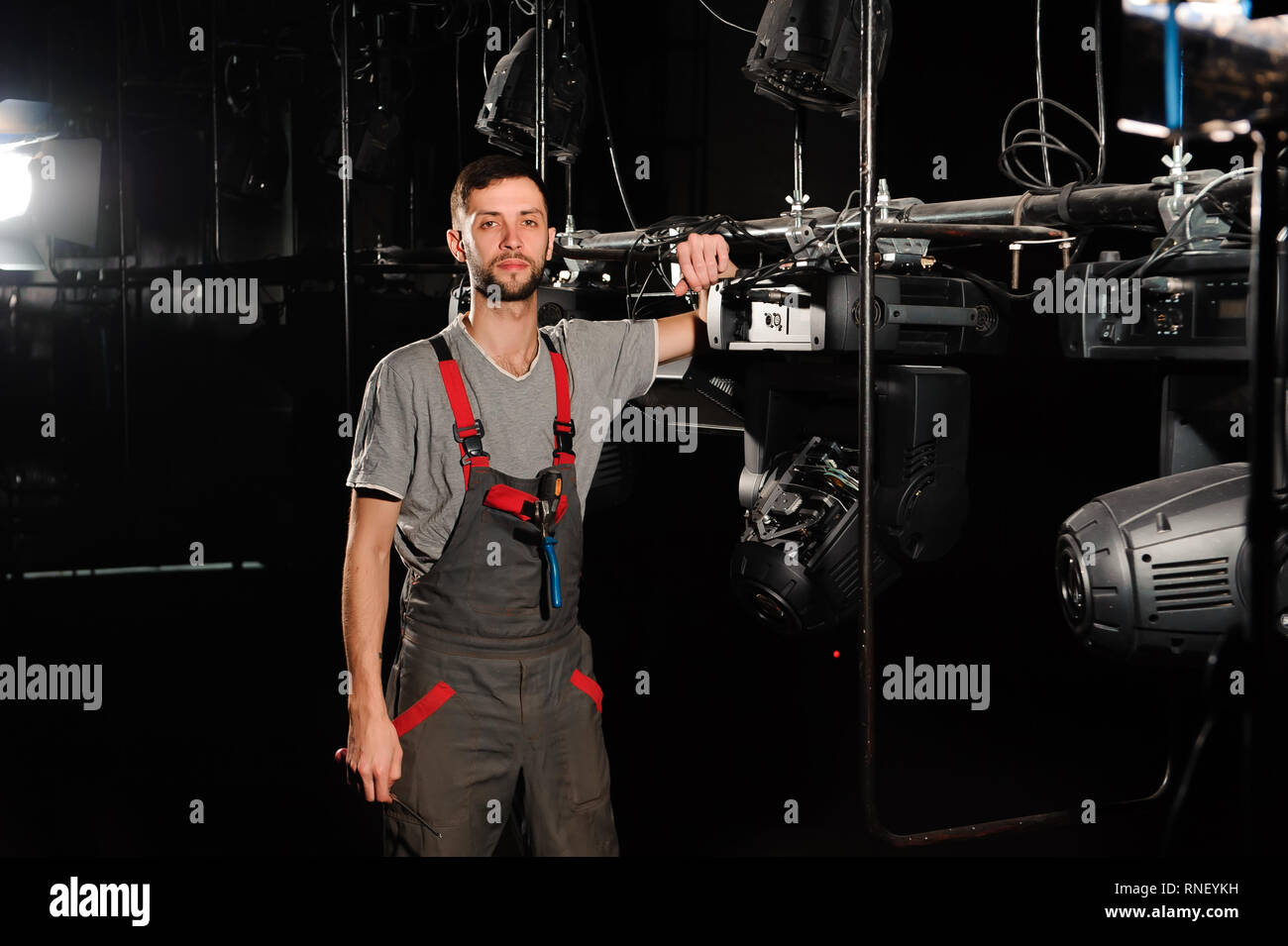 The lighting engineer adjusts the lights on the stage Stock Photo Alamy