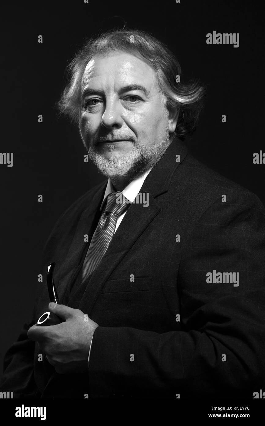 Man middle aged beard holding Black and White Stock Photos & Images - Alamy