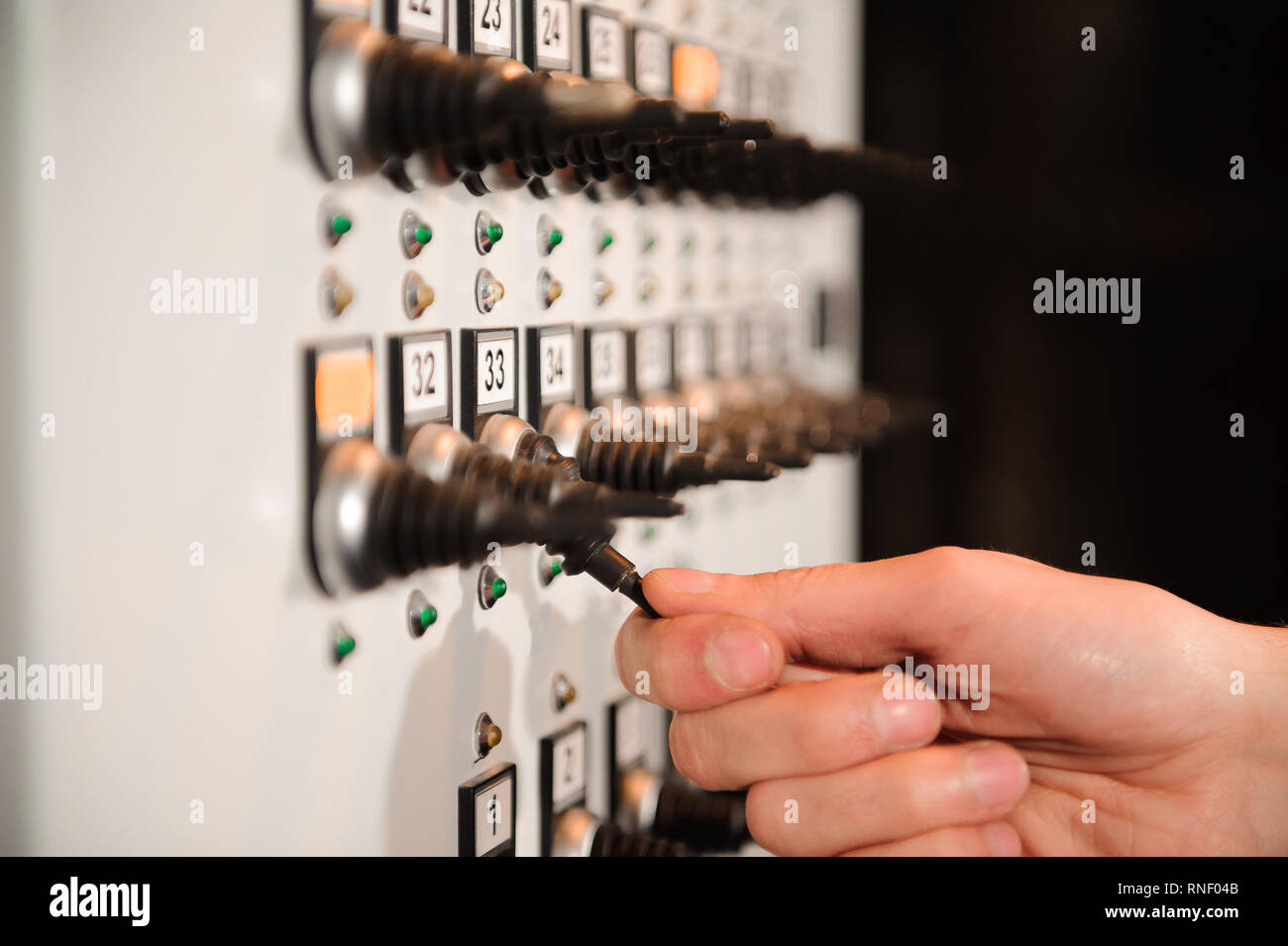 The lighting engineer adjusts the lights on stage Stock Photo Alamy