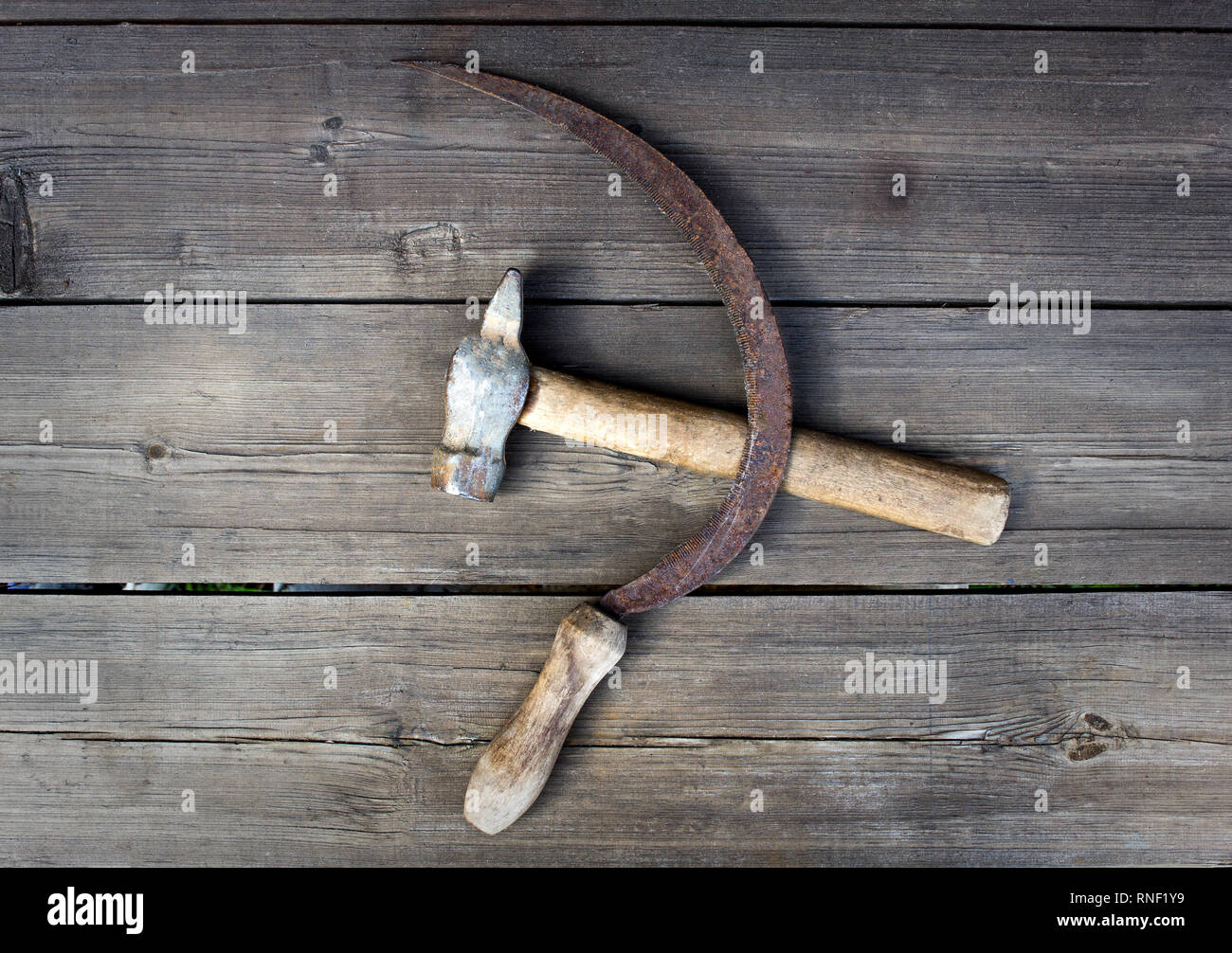 Sickle and hammer on wooden background, patriotism, reaping hook Stock  Photo - Alamy