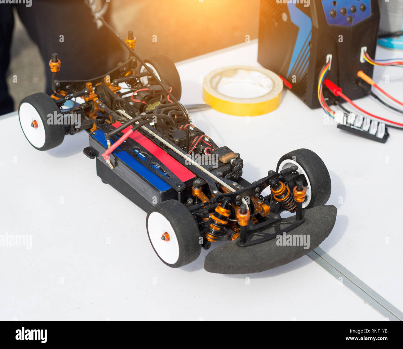 Preparation of an electric radio-controlled car before the start of a ...