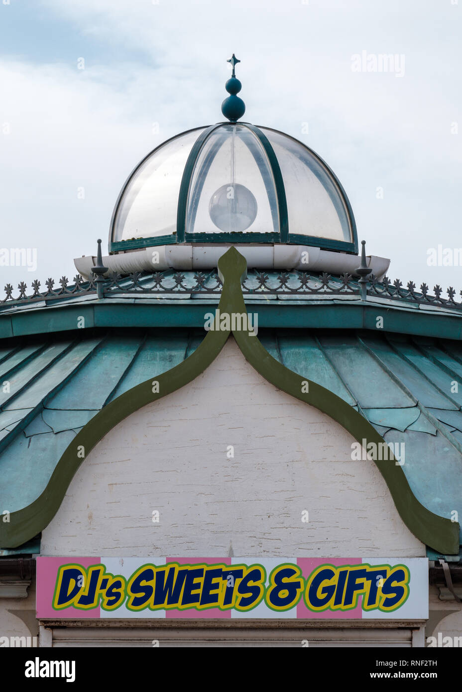 Victorian style green roof and glass dome of a building in Rhyl's Children's Village on a cloudy day, Rhyl, Denbighshire, North Wales Stock Photo