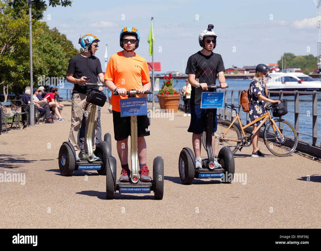 Copenhagen, Denmark - June 27, 2018:  A small group of people are using Segway two-wheeled self-balancing personal transporters near the Little Mermai Stock Photo