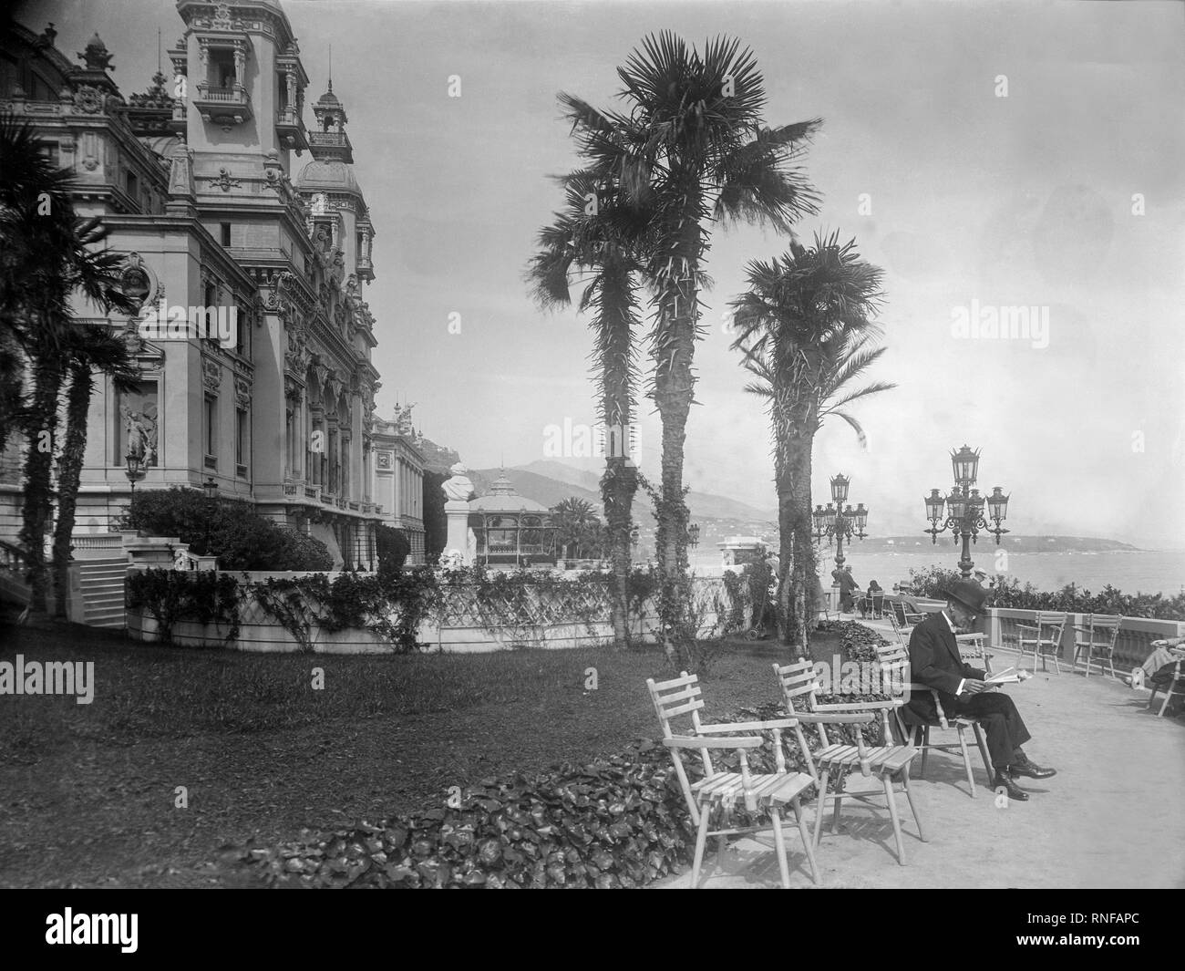 Vintage photograph showing the Promenade Des Anglais in Nice, France,taken in 1927. People can be seen relaxing along the Promenade dressed in the fashion of the period. Stock Photo