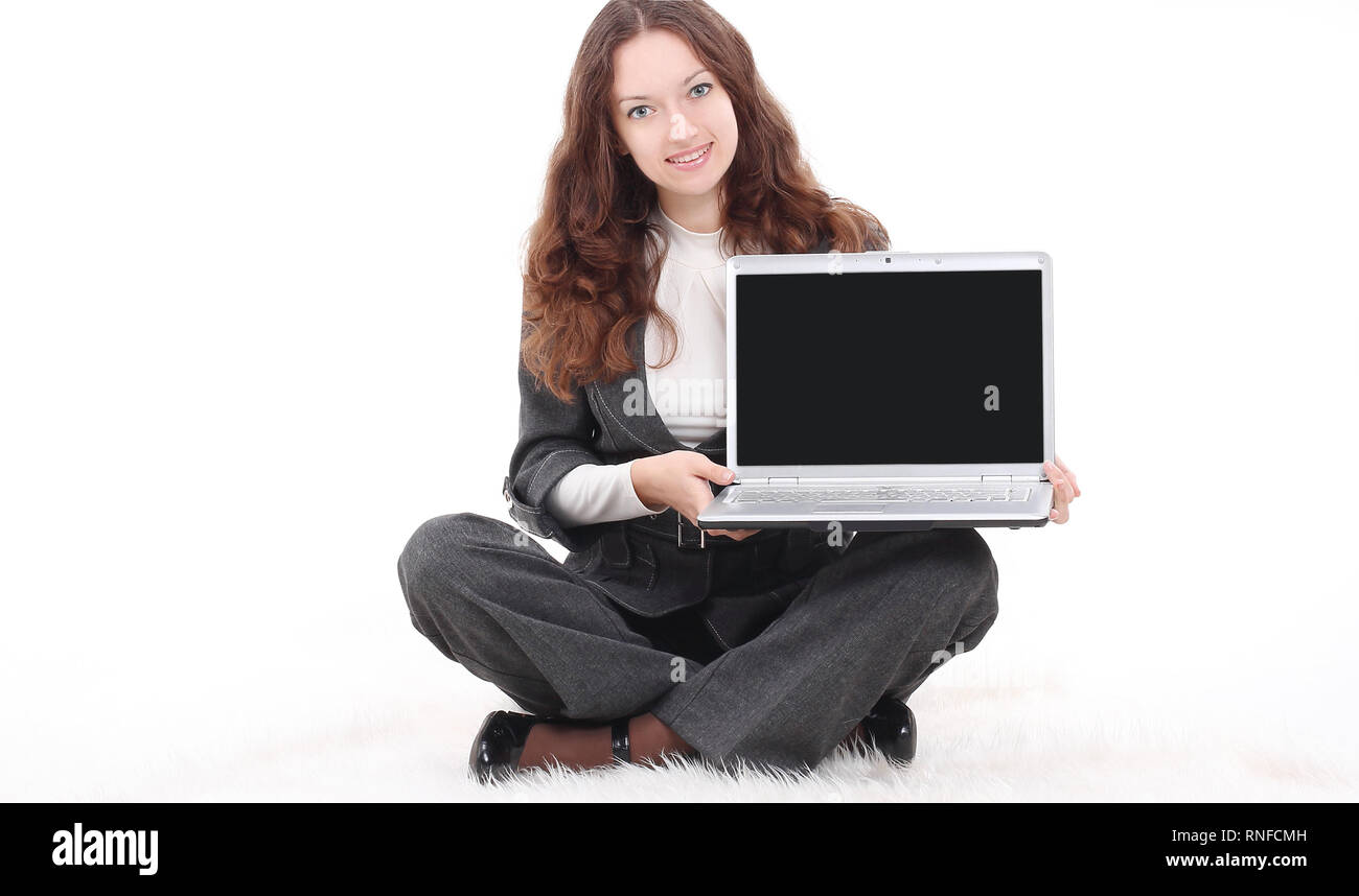 young business woman showing a laptop sitting on the floor Stock Photo ...