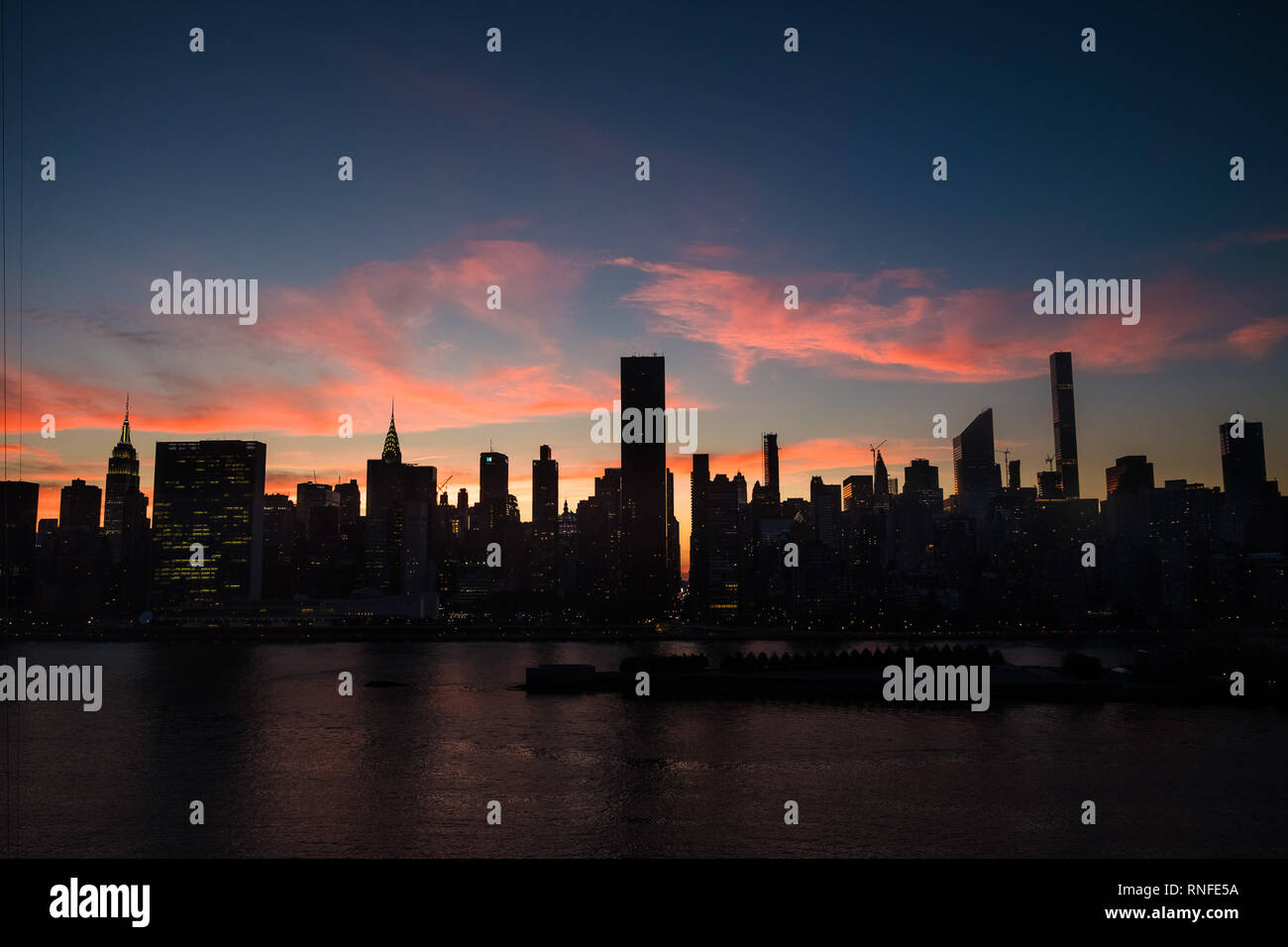 A glowing sunset over the Manhattan skyline, as seen from Long Island City, Queens Stock Photo