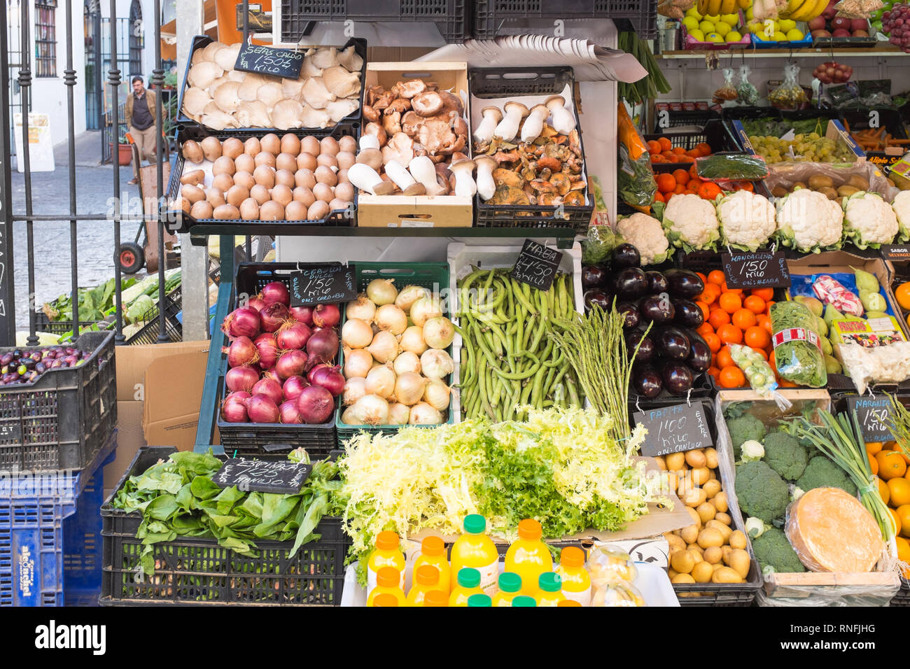 Fresh fruit and vegetables on display outside a small shop in the spanish city of Seville