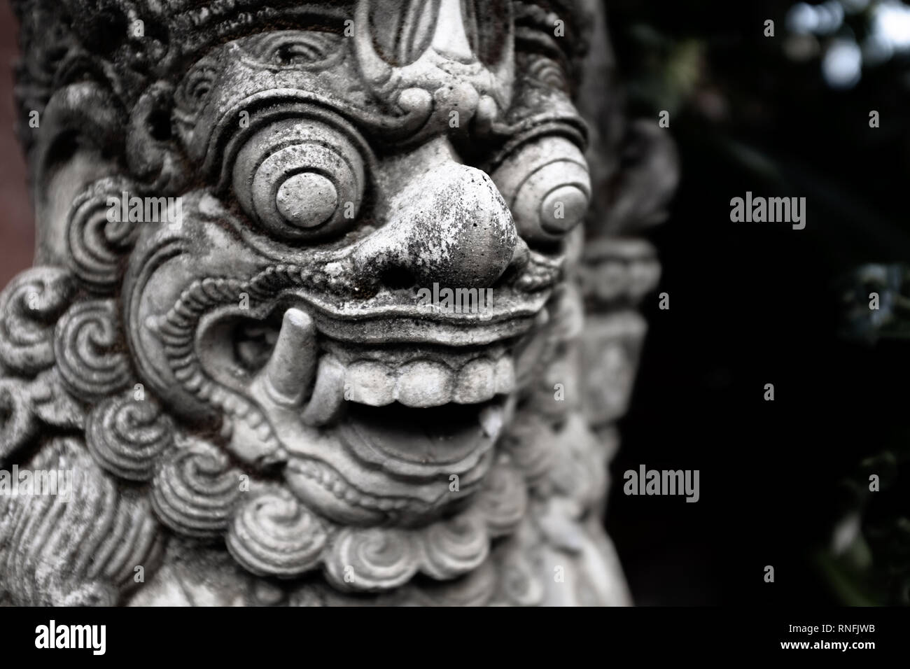 Close-up on a gate guardian (Dvarapala) in front of a balinese temple in Ubud, Bali, Indonesia Stock Photo