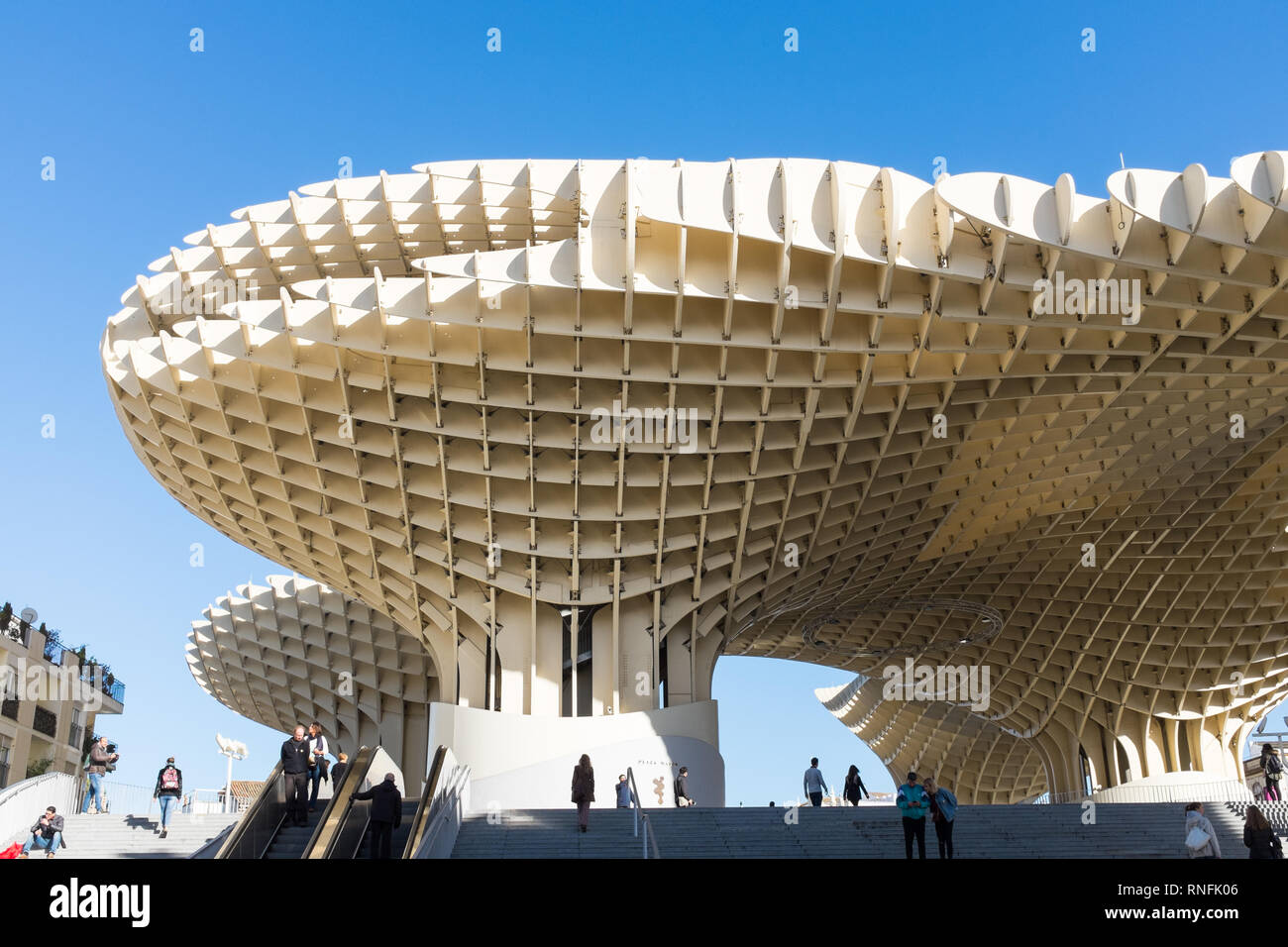 Escalator leading up to Metropol Parasol, one of the largest wooden structures ever built in the spanish city of Seville, Andalucia Stock Photo
