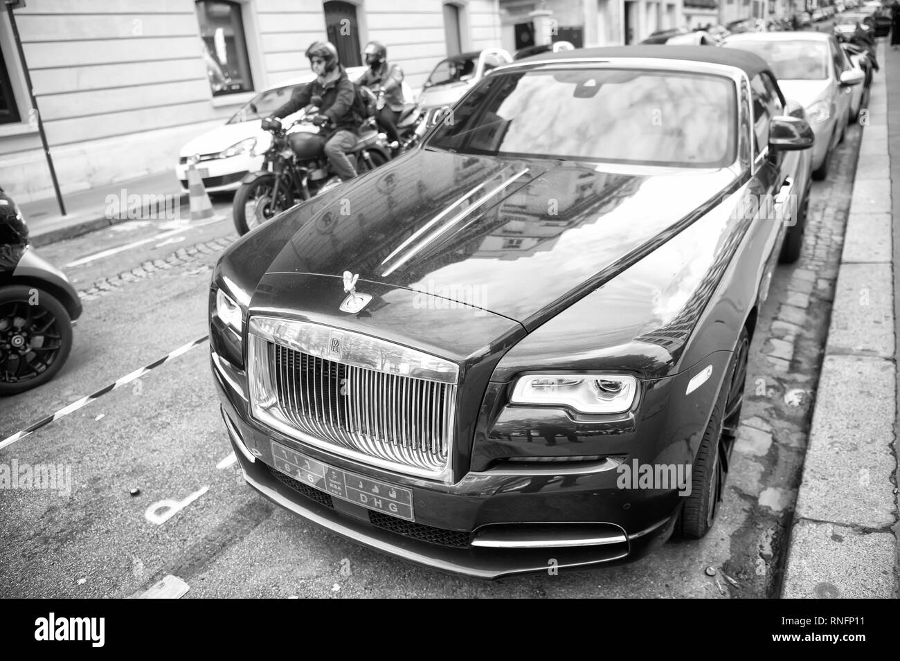 Paris, France - September 26, 23, 2017: luxury Supercar rolls royce rolls-royce ghost blue and gold color parked on the street in Paris. rolls royce rolls-royce is famous expensive automobile brand car Stock Photo