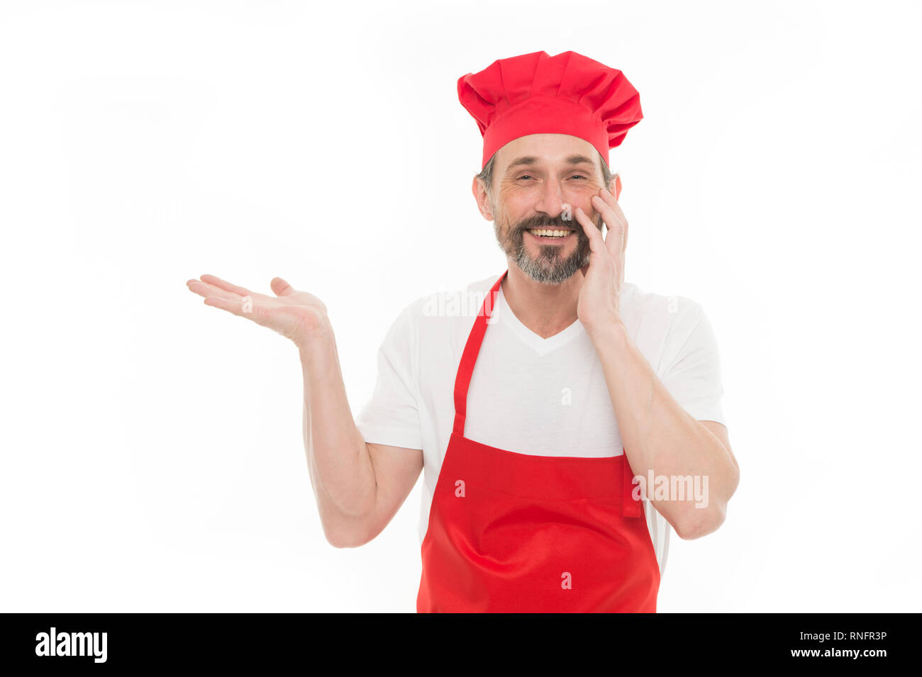 Presenting Product Bearded Mature Man In Chef Hat And Apron Pointing Hand Aside Senior Cook 