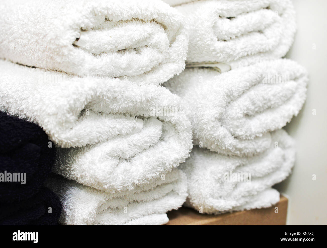 rolls of rolled towels are stacked. spa complex. Stock Photo