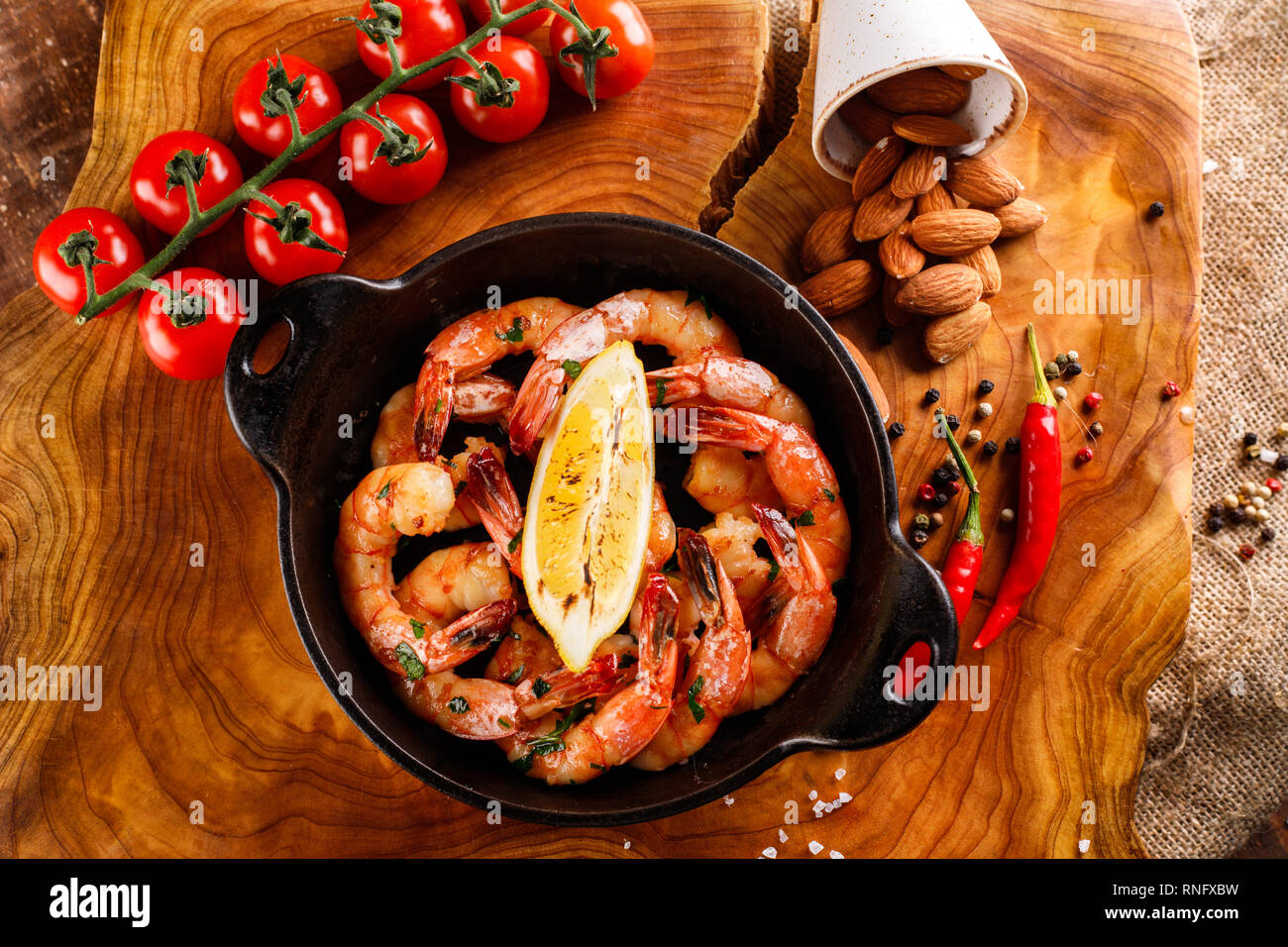Fried large shrimp in tomato sauce with olive oil, garlic, cilantro and