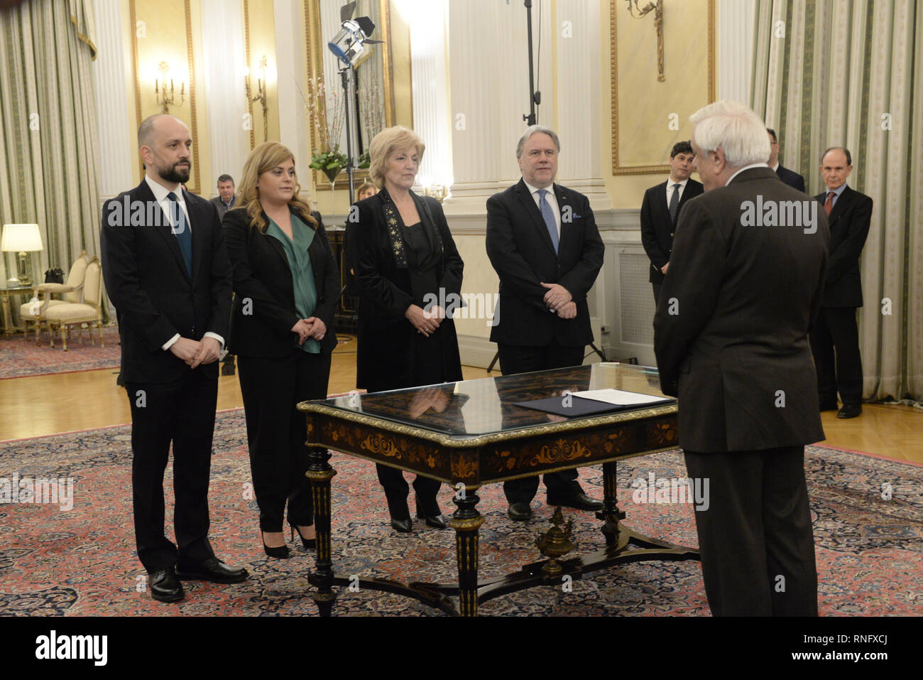 Athens, Greece. 18th Feb, 2019. From the left: Konstantinos Barkas, new Deputy Minister of Labor, Social Security and Social Solidarity, Eleftheria Chatzigeorgiou, new Deputy Minister of the Interior, Athanasia Anagnostopoulou, new Deputy Minister of Foreign Affairs and Georgios Katrougalos, new Minister of Foreign Affairs, during the political oath to the President of Hellenic Republic Prokopis Pavlopoulos. Credit: Dimitrios Karvountzis/Pacific Press/Alamy Live News Stock Photo