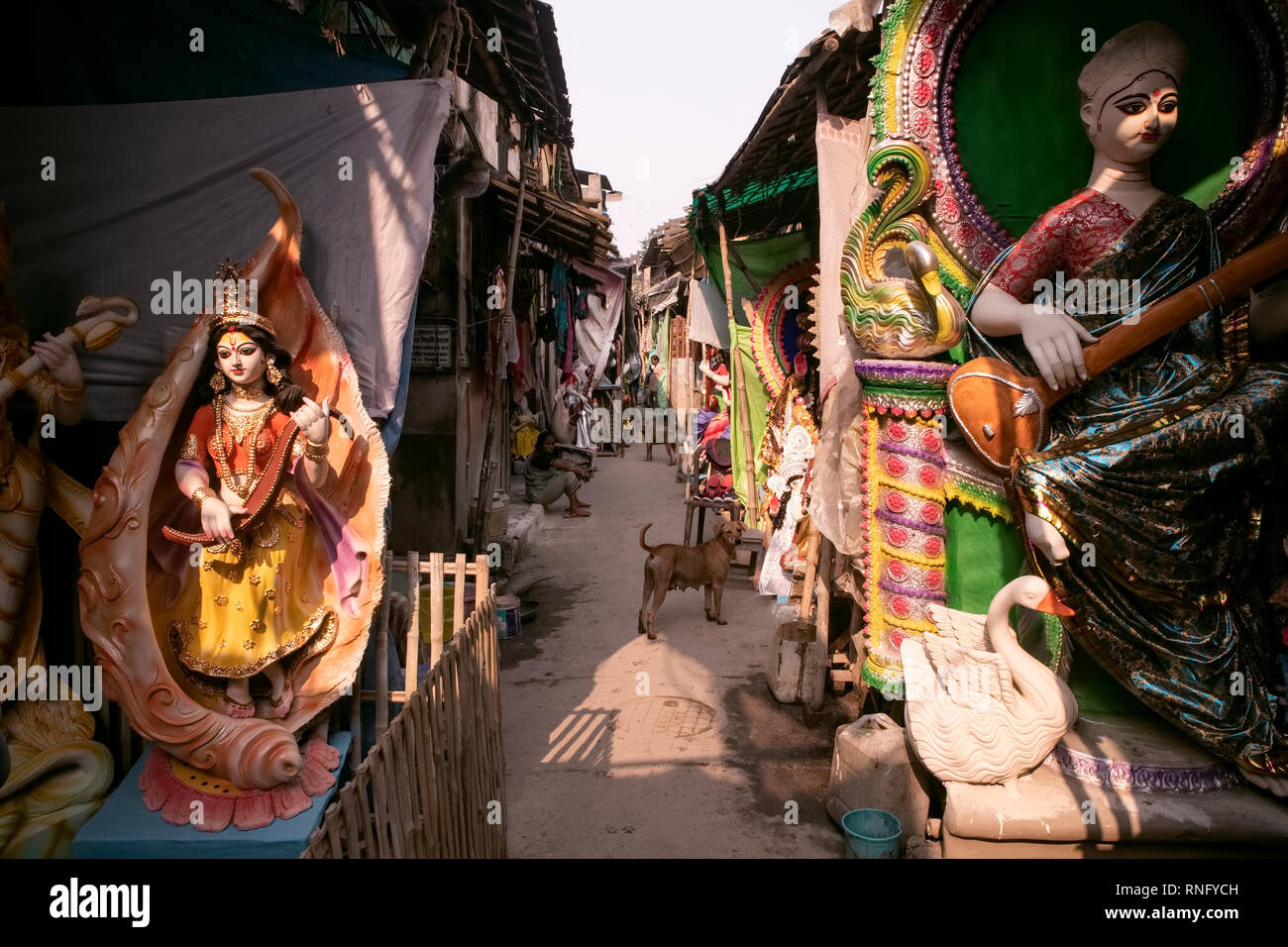 Clay idol ,making,studios,Goddess Saraswati,stray dogs,Kumartuli,Kolkata, ararrangements,finnishing,idols,ensuing,worship,on,Vasant Panchami,day,Sprin Stock Photo