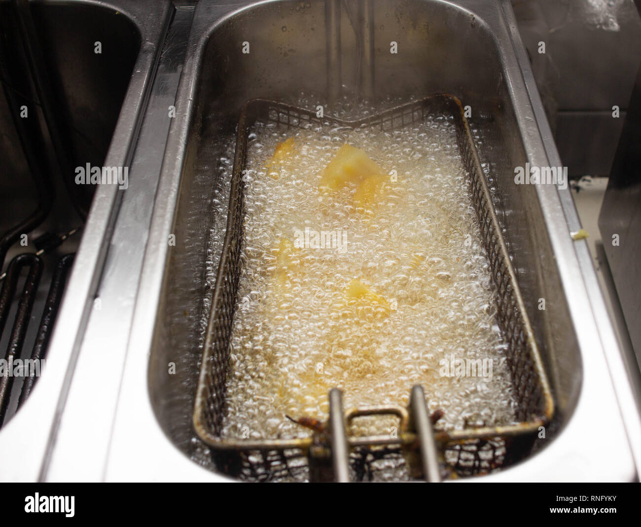 Boiling and boiling oil in which fries are fried and rustic in a fast
