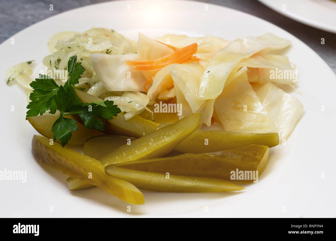 restaurant dish appetizer with cucumber and cabbage, closeup