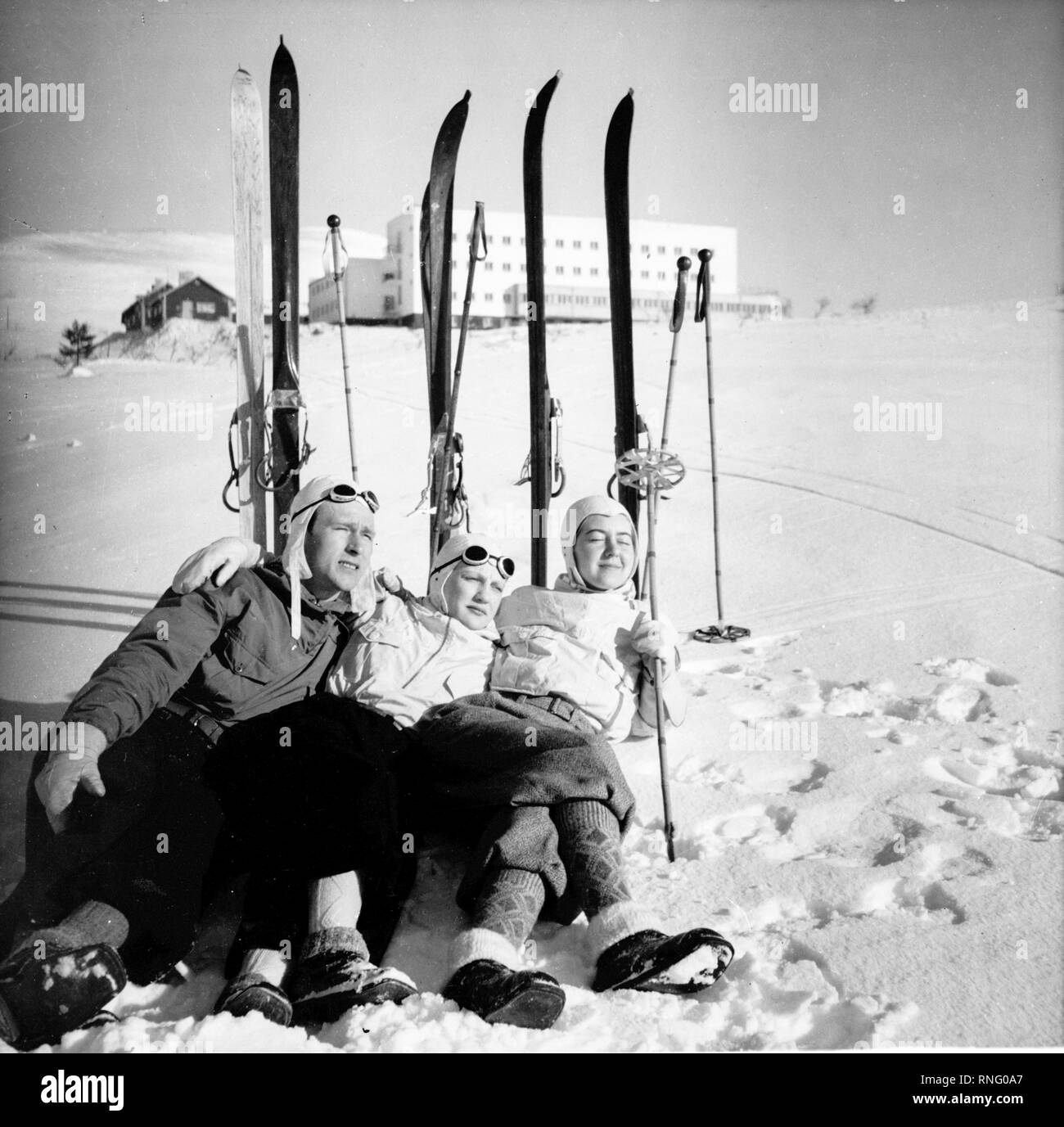 Finland History - Three skiers chilling on snow, enjoying the sun in ...