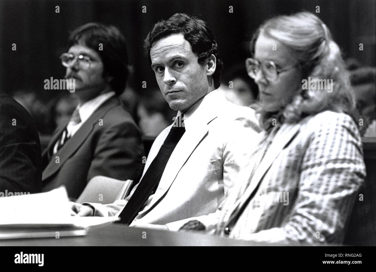 Ted Bundy Murder Trial - Miami - Ted Bundy with defense attorney Margaret Good at the defense table. Theodore Robert Bundy was an American serial killer, kidnapper, rapist, burglar, and necrophile who assaulted and murdered numerous young women and girls during the 1970s and possibly earlier. After more than a decade of denials, he confessed to 30 homicides that he committed in seven states between 1974 and 1978. Stock Photo