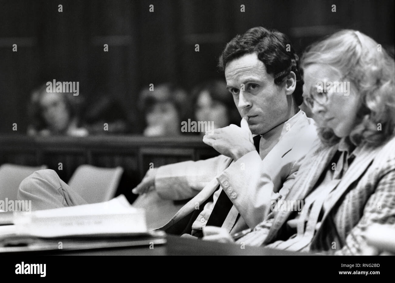 Ted Bundy Murder Trial - Miami - Ted Bundy with defense attorney Margaret Good at the defense table. Theodore Robert Bundy was an American serial killer, kidnapper, rapist, burglar, and necrophile who assaulted and murdered numerous young women and girls during the 1970s and possibly earlier. After more than a decade of denials, he confessed to 30 homicides that he committed in seven states between 1974 and 1978. Stock Photo